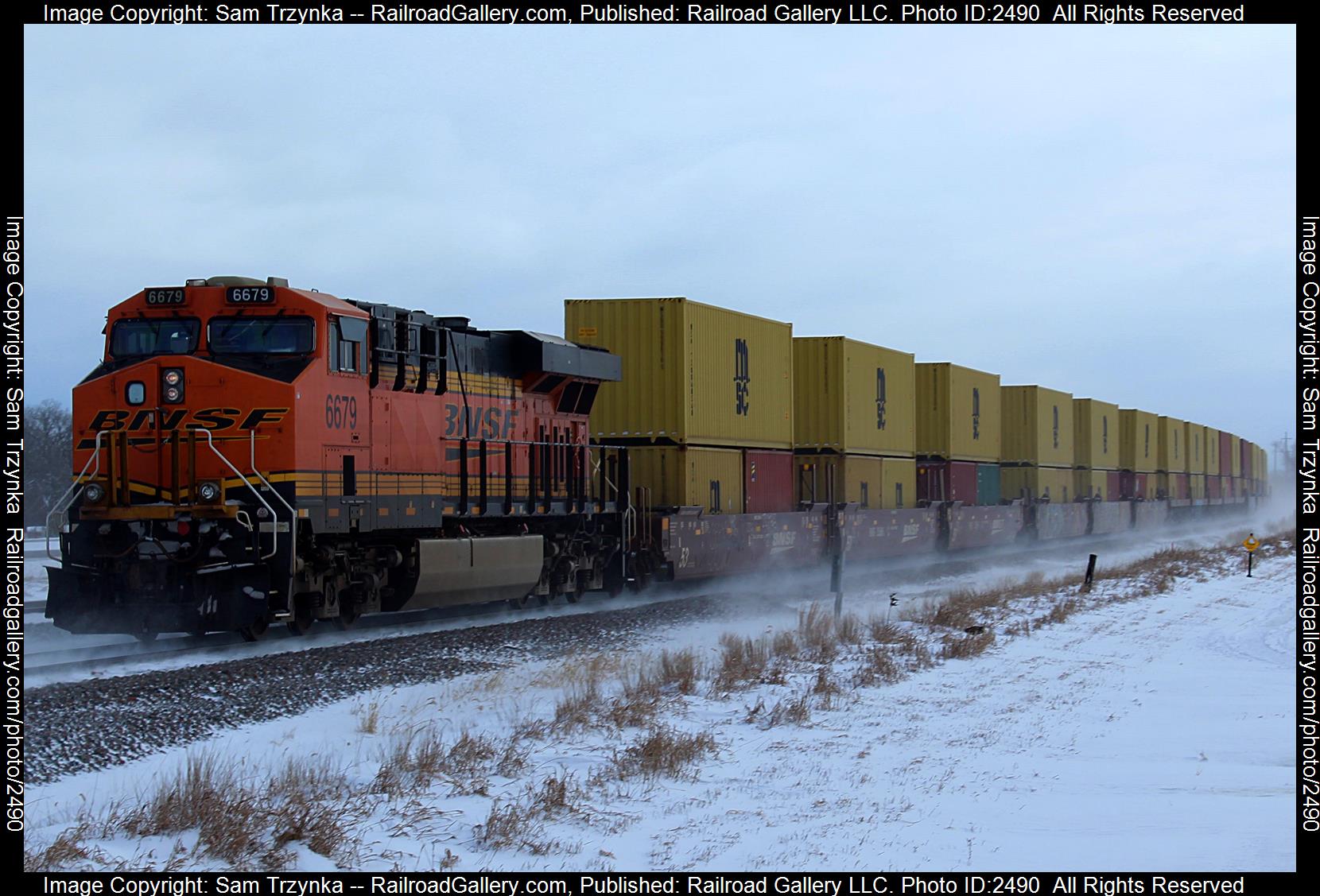 BNSF 6679 is a class GE ES44C4 and  is pictured in Big Lake, Minnesota, USA.  This was taken along the BNSF Staples Subdivision on the BNSF Railway. Photo Copyright: Sam Trzynka uploaded to Railroad Gallery on 11/24/2023. This photograph of BNSF 6679 was taken on Sunday, March 06, 2022. All Rights Reserved. 