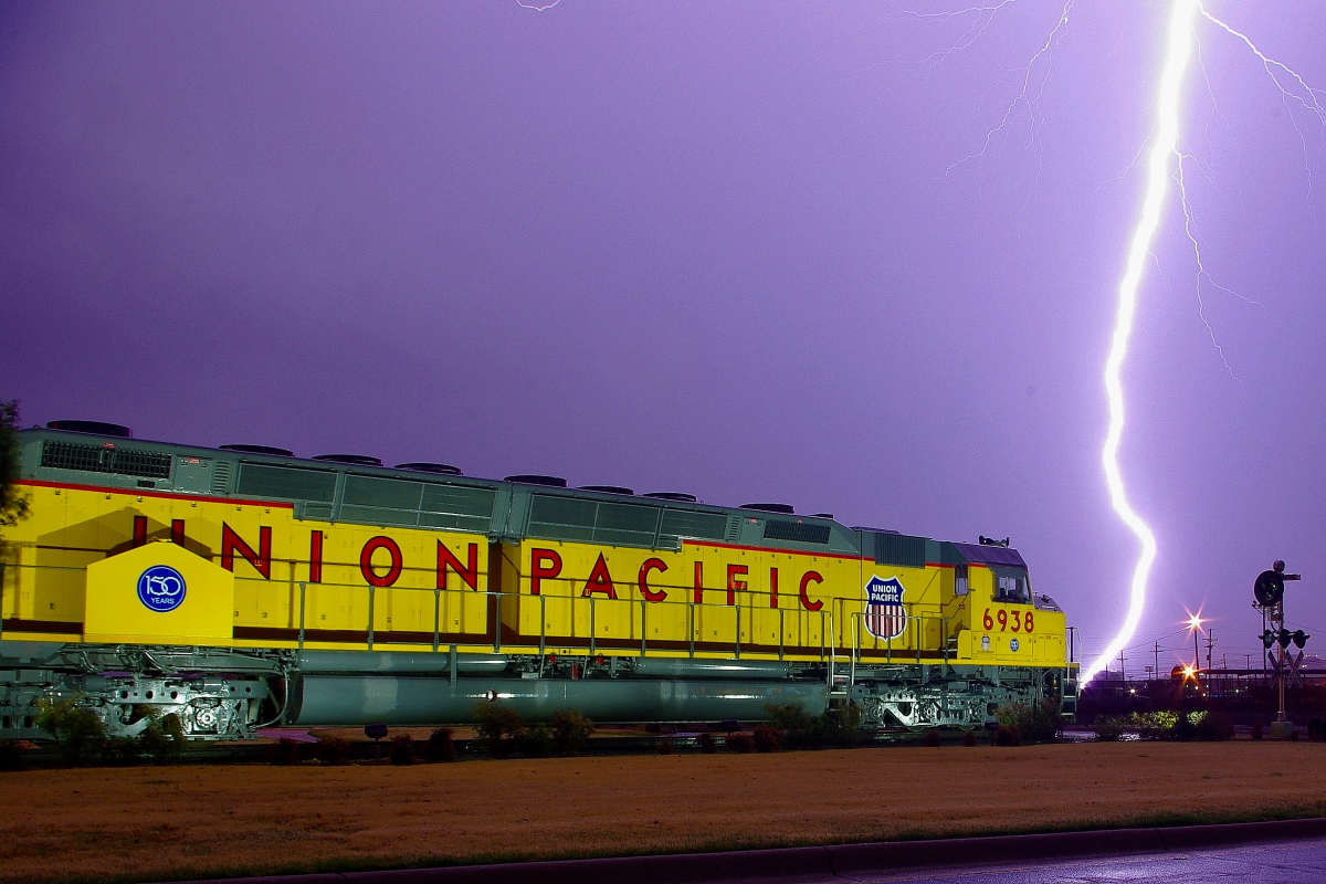 UP 6938 is a class EMD DD40X and  is pictured in Little Rock, Arkansas, USA.  This was taken along the Little Rock/UP on the Union Pacific Railroad. Photo Copyright: Rick Doughty uploaded to Railroad Gallery on 12/20/2023. This photograph of UP 6938 was taken on Friday, April 04, 2014. All Rights Reserved. 