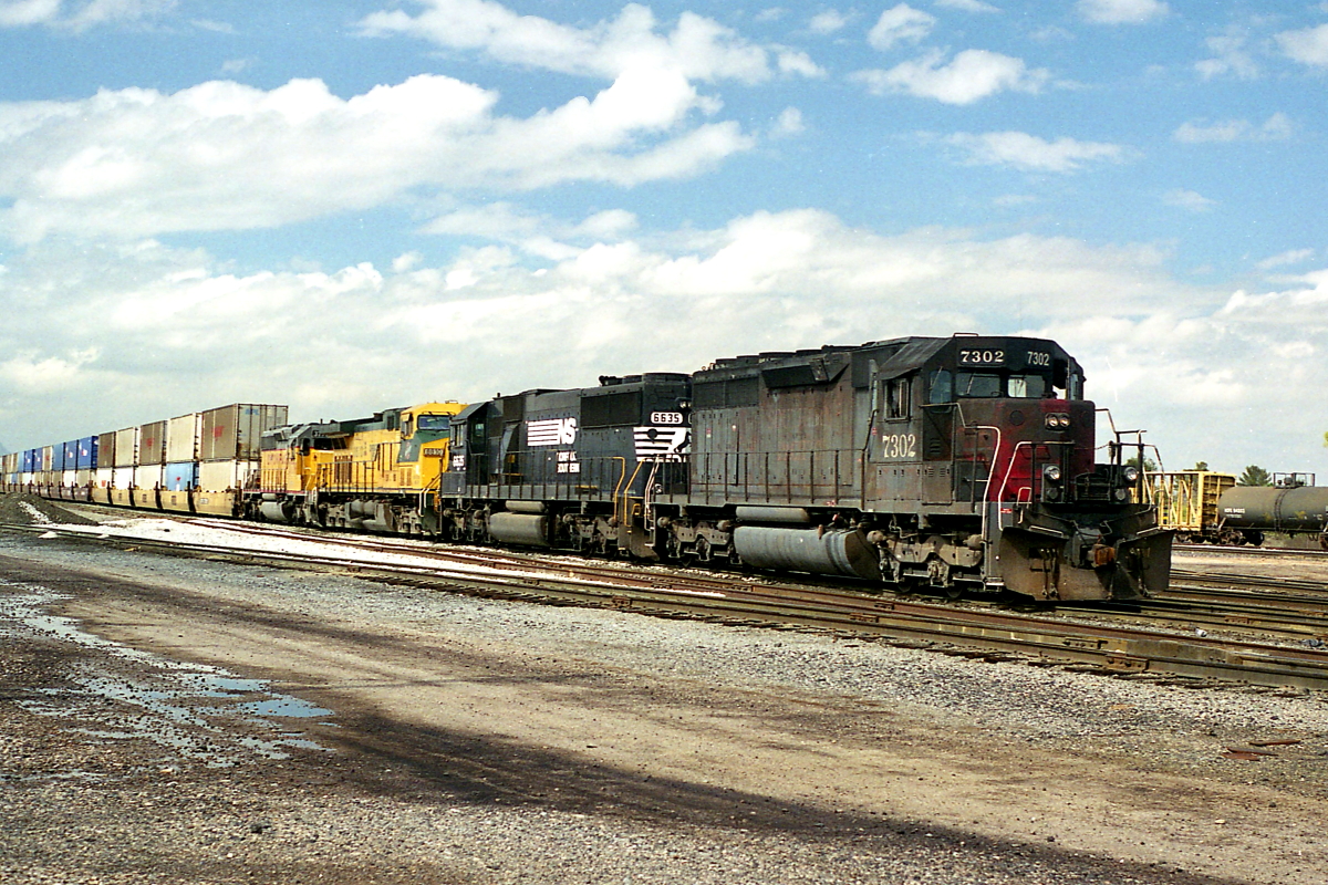 SP 7302 is a class EMD SD40 and  is pictured in Tucson, Arizona, USA.  This was taken along the Lordsburg/UP on the Southern Pacific Transportation Company. Photo Copyright: Rick Doughty uploaded to Railroad Gallery on 02/07/2024. This photograph of SP 7302 was taken on Thursday, October 12, 2000. All Rights Reserved. 