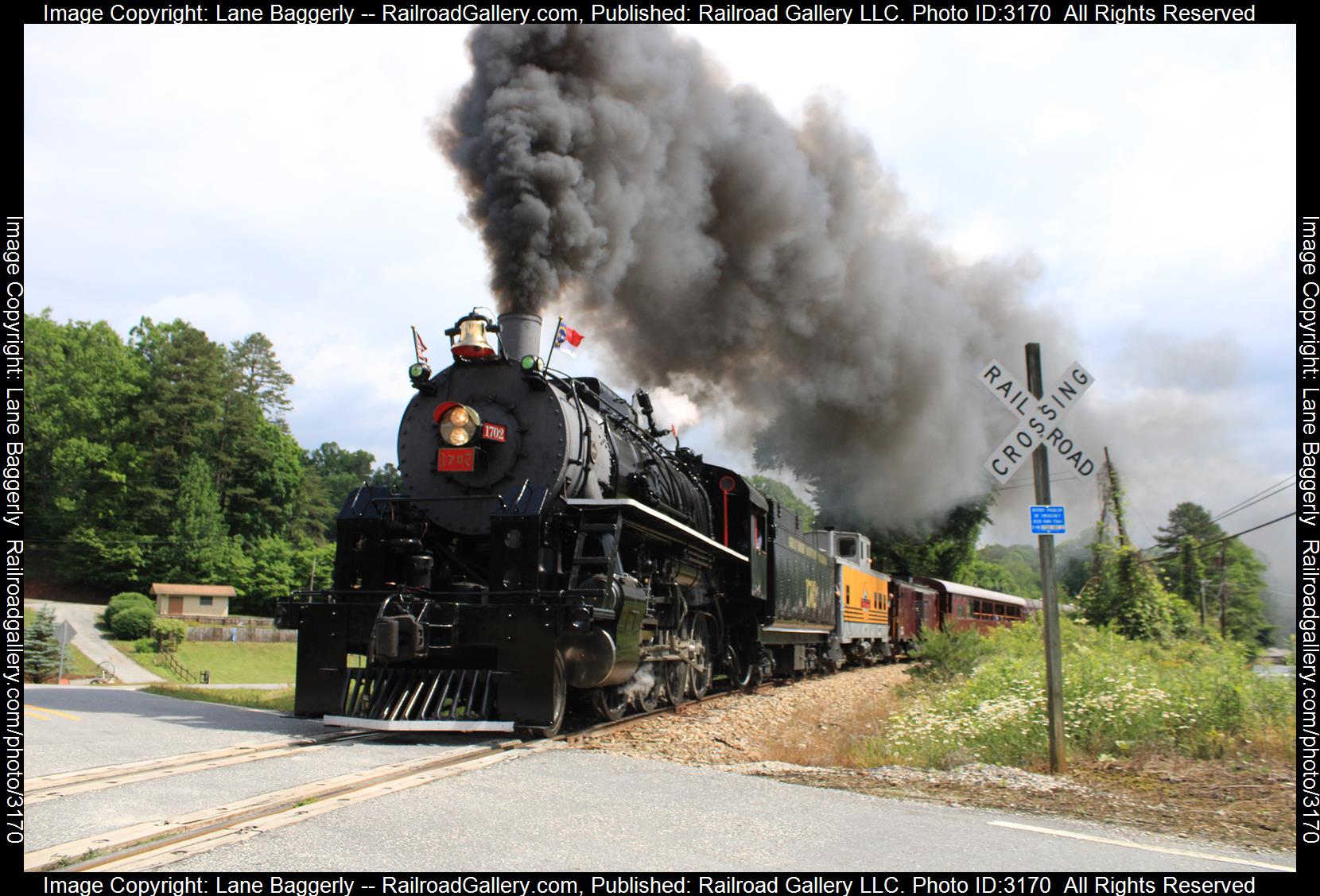 GSMR 1702 is a class 2-8-0 and  is pictured in Bryson City, North Carolina, United States.  This was taken along the Murphy Branch on the Great Smoky Mountain . Photo Copyright: Lane Baggerly uploaded to Railroad Gallery on 03/02/2024. This photograph of GSMR 1702 was taken on Friday, May 27, 2022. All Rights Reserved. 