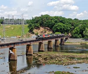 AC&W train 300 startles a heron as it crosses the Pee Dee River