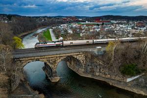 Amtrak's Pennsylvanian Crosses Loyalhanna Creek in Latrobe, PA with P42DC 130 in Phase II Livery