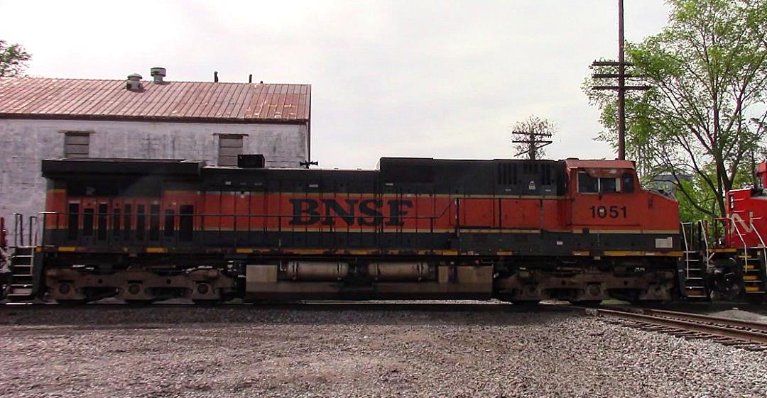 BNSF 1051 is a class GE C44-9W (Dash 9-44CW) and  is pictured in Ashley, Illinois, USA.  This was taken along the CN Centralia subdivision on the BNSF Railway. Photo Copyright: Blaise Lambert uploaded to Railroad Gallery on 05/04/2023. This photograph of BNSF 1051 was taken on Thursday, May 04, 2023. All Rights Reserved. 