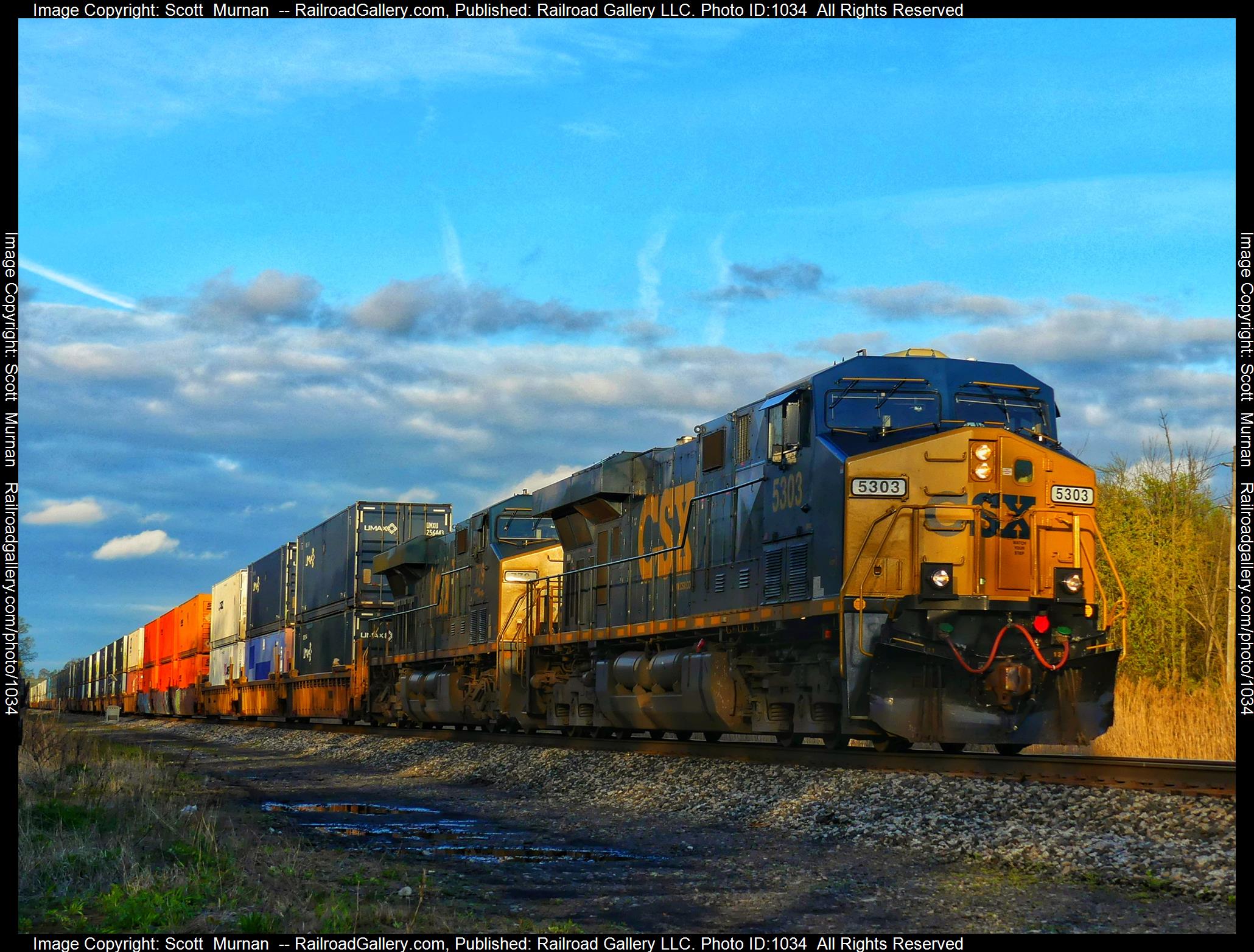 CSX 5303 is a class GE ES40DC and  is pictured in Macedon, New York, United States.  This was taken along the Rochester Subdivision  on the CSX Transportation. Photo Copyright: Scott  Murnan  uploaded to Railroad Gallery on 05/04/2023. This photograph of CSX 5303 was taken on Thursday, May 04, 2023. All Rights Reserved. 