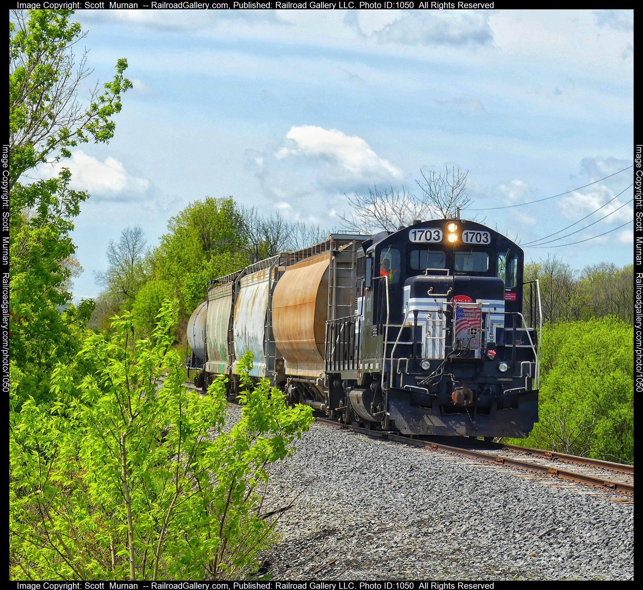 FGLK 1703 is a class EMD GP9 and  is pictured in Canandaigua , New York, United States.  This was taken along the Canandaigua Branch on the Finger Lakes Railway. Photo Copyright: Scott  Murnan  uploaded to Railroad Gallery on 05/08/2023. This photograph of FGLK 1703 was taken on Monday, May 08, 2023. All Rights Reserved. 