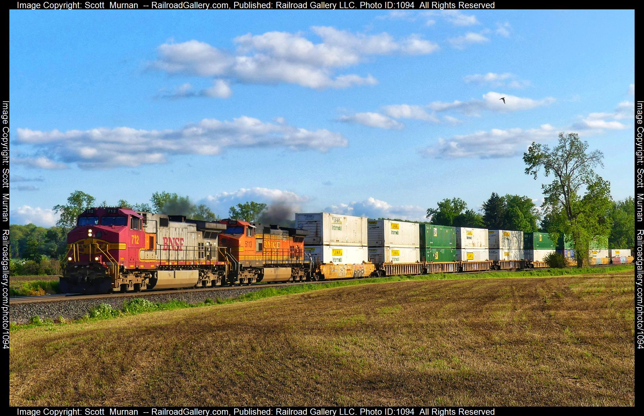 BNSF 712 is a class GE C44-9W (Dash 9-44CW) and  is pictured in Attica, New York, United States.  This was taken along the Southern Tier Line on the Norfolk Southern. Photo Copyright: Scott  Murnan  uploaded to Railroad Gallery on 05/24/2023. This photograph of BNSF 712 was taken on Wednesday, May 24, 2023. All Rights Reserved. 