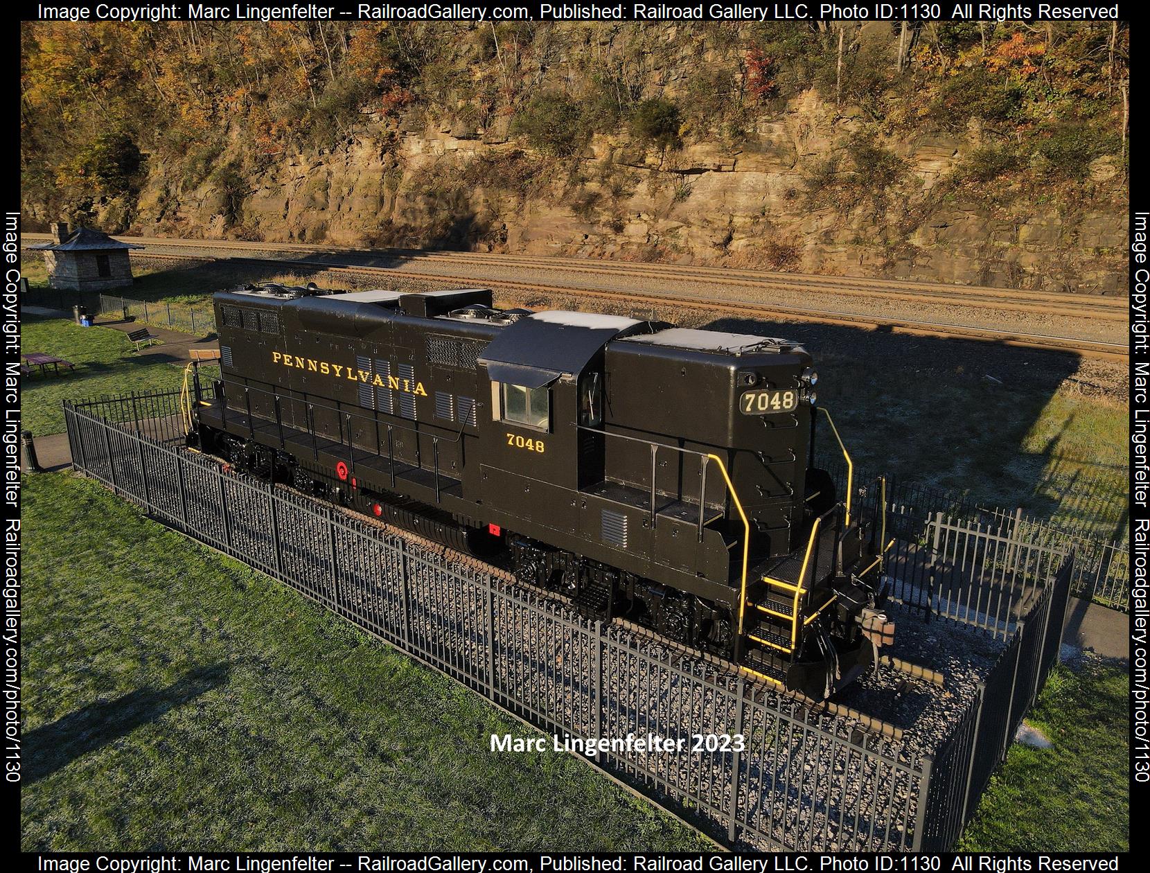 PRR 7048 is a class EMD GP9 and  is pictured in Altoona, Pennsylvania, USA.  This was taken along the Horseshoe Curve on the Pennsylvania Railroad. Photo Copyright: Marc Lingenfelter uploaded to Railroad Gallery on 06/12/2023. This photograph of PRR 7048 was taken on Wednesday, November 03, 2021. All Rights Reserved. 