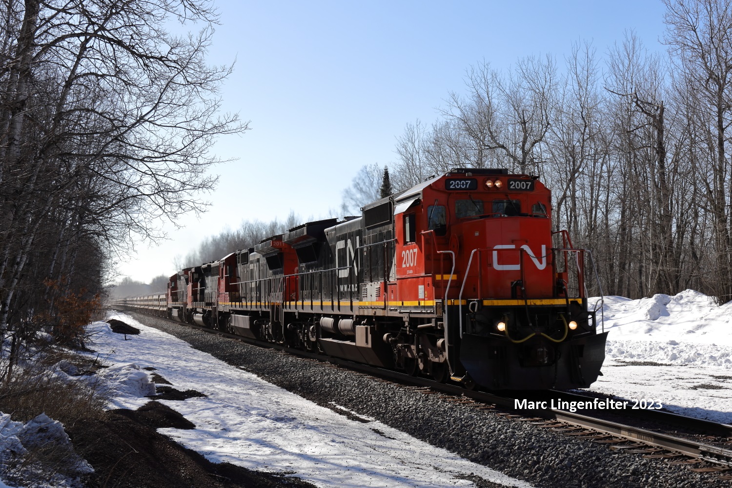 CN 2007 is a class GE C40-8 (Dash 8-40C) and  is pictured in Saginaw, Minnesota, USA.  This was taken along the CN Missabe Sub on the Canadian National Railway. Photo Copyright: Marc Lingenfelter uploaded to Railroad Gallery on 06/20/2023. This photograph of CN 2007 was taken on Wednesday, March 29, 2023. All Rights Reserved. 