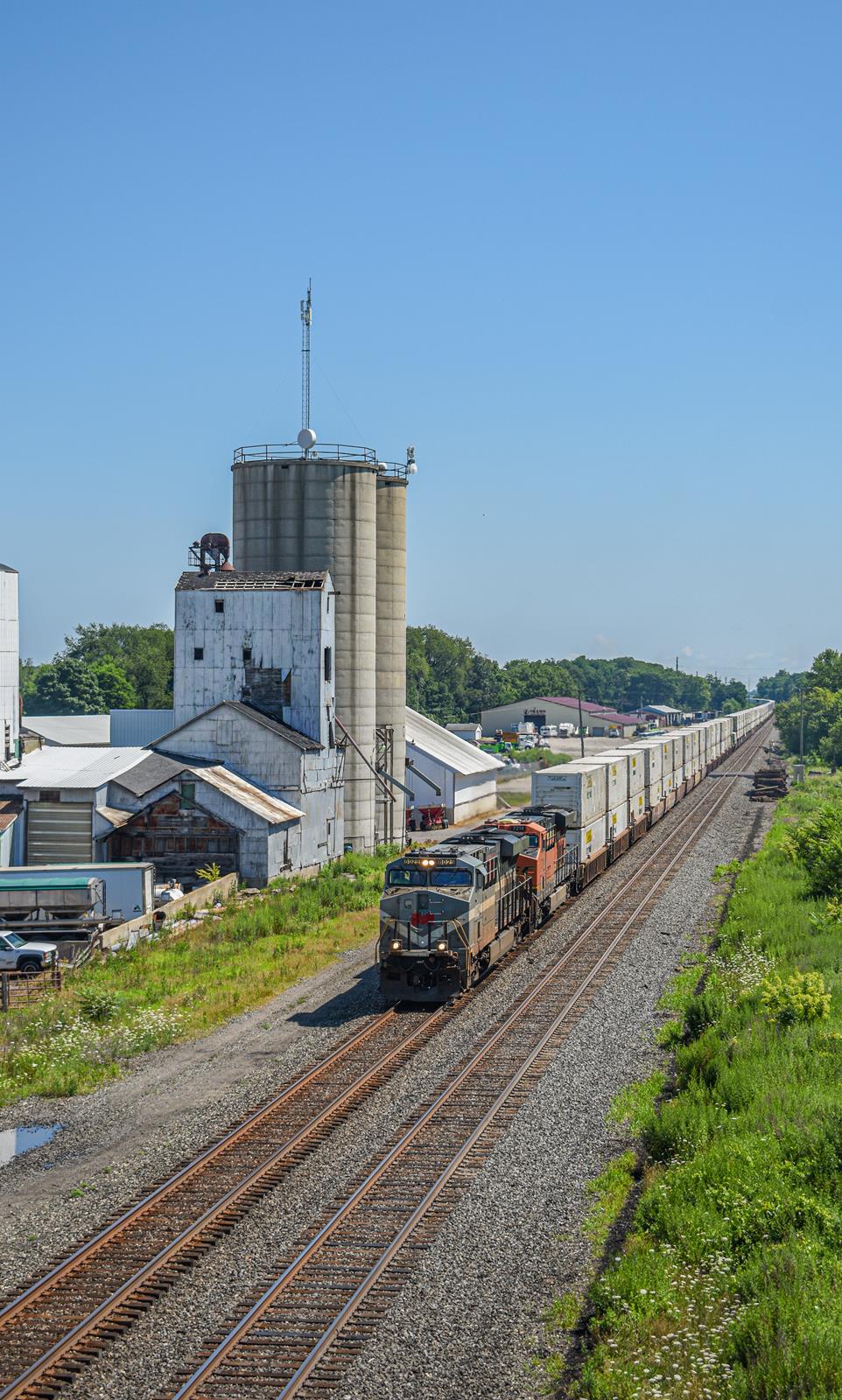 NS 8025 is a class GE ES44AC and  is pictured in Rolling Prairie, Indiana, United States.  This was taken along the NS Dearborn Division/Chicago Line on the Norfolk Southern. Photo Copyright: Reed Hamilton uploaded to Railroad Gallery on 11/15/2022. This photograph of NS 8025 was taken on Monday, July 18, 2022. All Rights Reserved. 