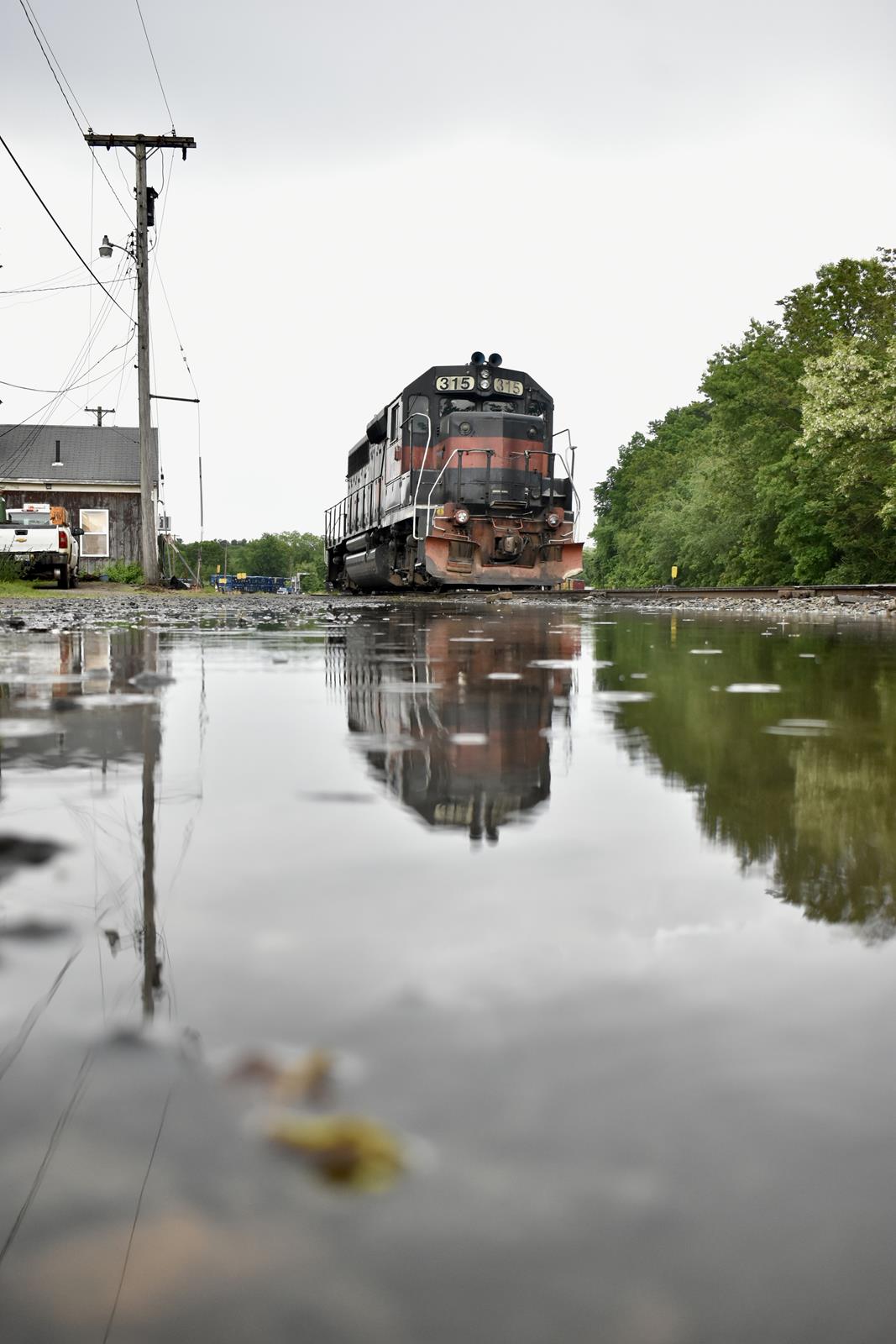 MEC 315 is a class GP40-2 and  is pictured in Nashua, Massachusetts , United States.  This was taken along the Pan Am on the Guilford/Pan Am. Photo Copyright: Cody Booker uploaded to Railroad Gallery on 11/16/2022. This photograph of MEC 315 was taken on Saturday, May 28, 2022. All Rights Reserved. 