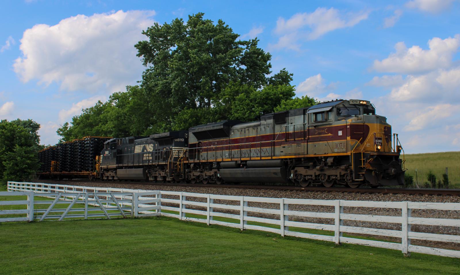 NS 1074 is a class EMD SD70ACe and  is pictured in Harrodsburg, KY, Kentucky, United States.  This was taken along the Louisville District on the Norfolk Southern. Photo Copyright: Chris Hall uploaded to Railroad Gallery on 11/21/2022. This photograph of NS 1074 was taken on Sunday, June 12, 2022. All Rights Reserved. 