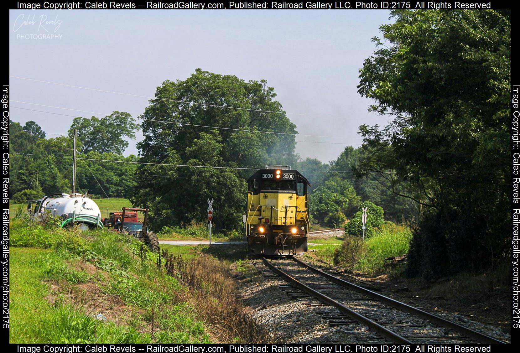 HRT 3000 is a class EMD GP40 and  is pictured in Canon, Georgia, USA.  This was taken along the Hartwell Railroad Elberton Line  on the Hartwell Railroad. Photo Copyright: Caleb Revels uploaded to Railroad Gallery on 06/30/2023. This photograph of HRT 3000 was taken on Thursday, June 29, 2023. All Rights Reserved. 