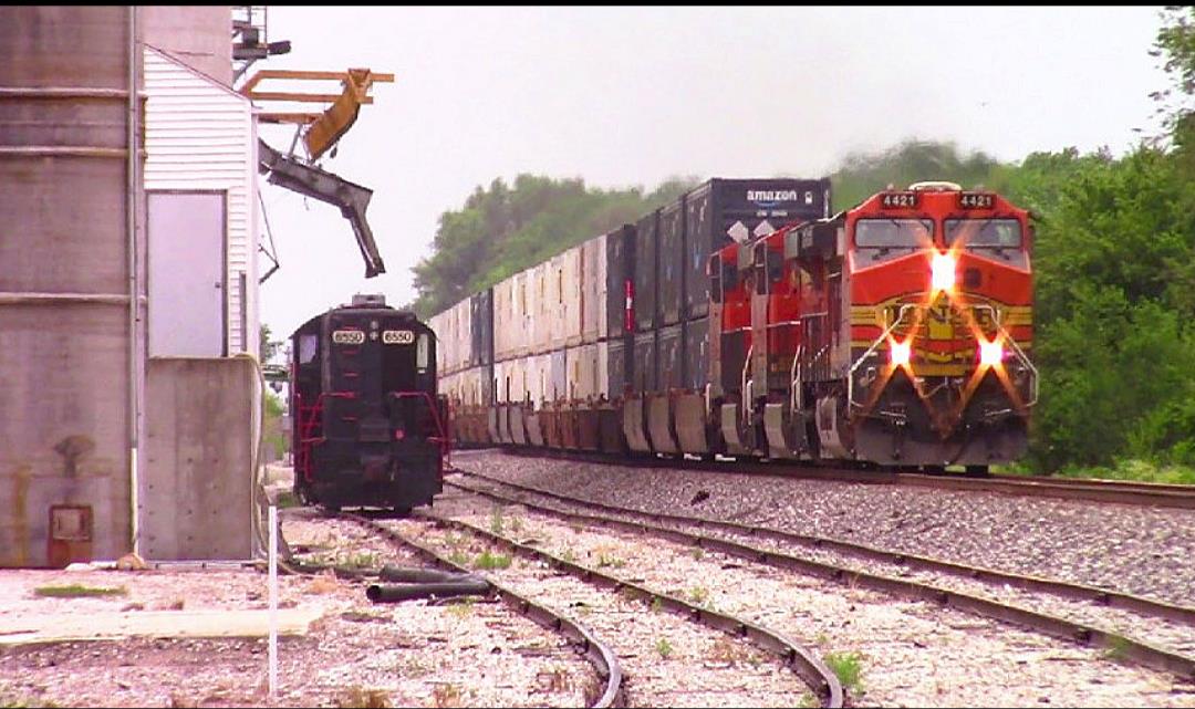 BNSF 4421 is a class GE C44-9W (Dash 9-44CW) and  is pictured in Norborne, Missouri, USA.  This was taken along the NS Kansas City District on the BNSF Railway. Photo Copyright: Blaise Lambert uploaded to Railroad Gallery on 07/31/2023. This photograph of BNSF 4421 was taken on Saturday, July 01, 2023. All Rights Reserved. 