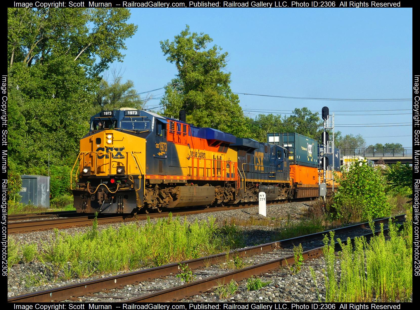 CSX 1973 is a class GE ES44AC and  is pictured in Perinton , New York, United States.  This was taken along the Rochester Subdivision  on the CSX Transportation. Photo Copyright: Scott  Murnan  uploaded to Railroad Gallery on 09/04/2023. This photograph of CSX 1973 was taken on Monday, September 04, 2023. All Rights Reserved. 