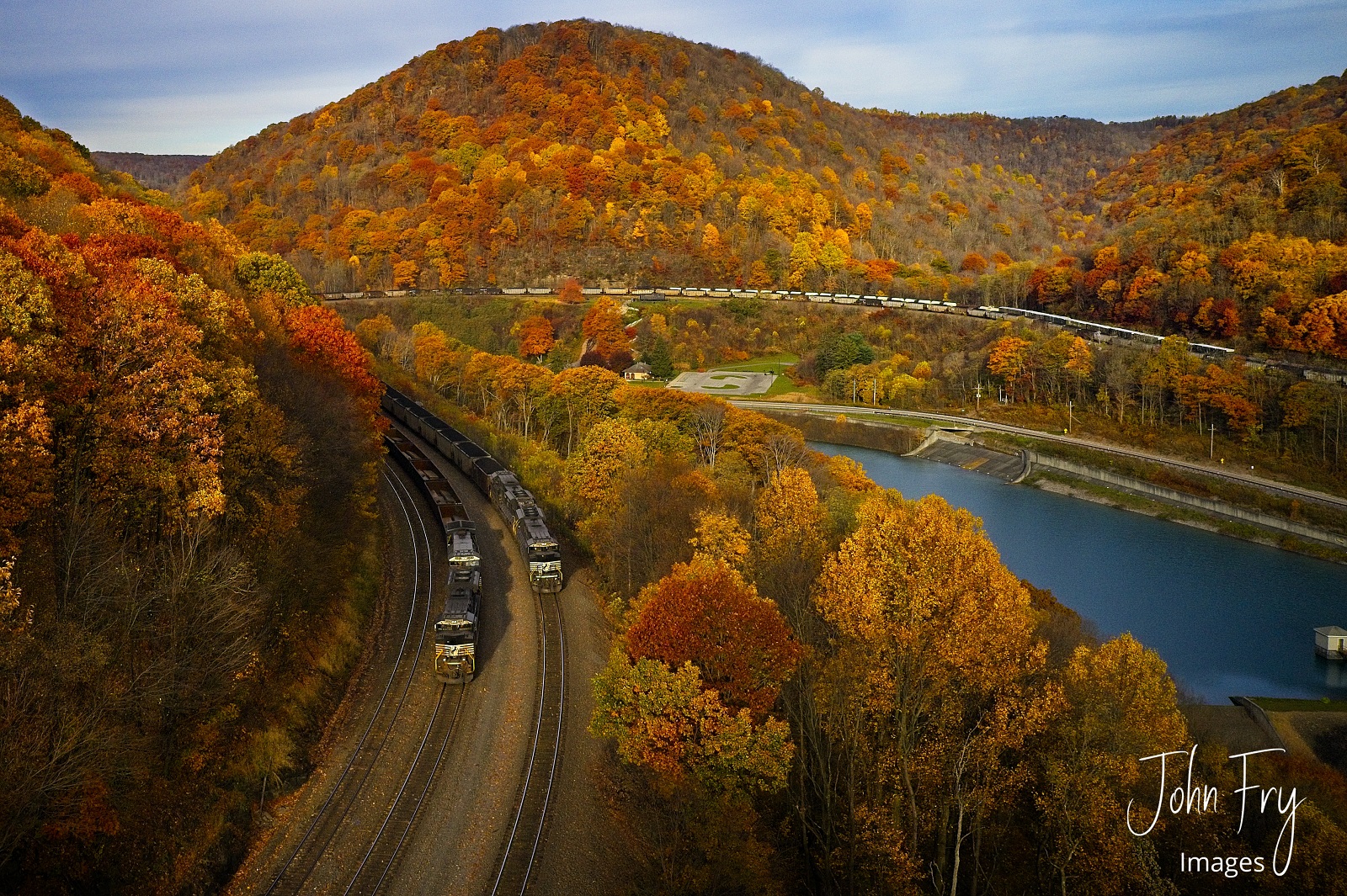 NS 1104 is a class SD70ACE and  is pictured in Altoona, Pennsylvania, United States.  This was taken along the Pittsburgh line on the Norfolk Southern. Photo Copyright: John  Fry uploaded to Railroad Gallery on 10/16/2023. This photograph of NS 1104 was taken on Friday, October 28, 2022. All Rights Reserved. 