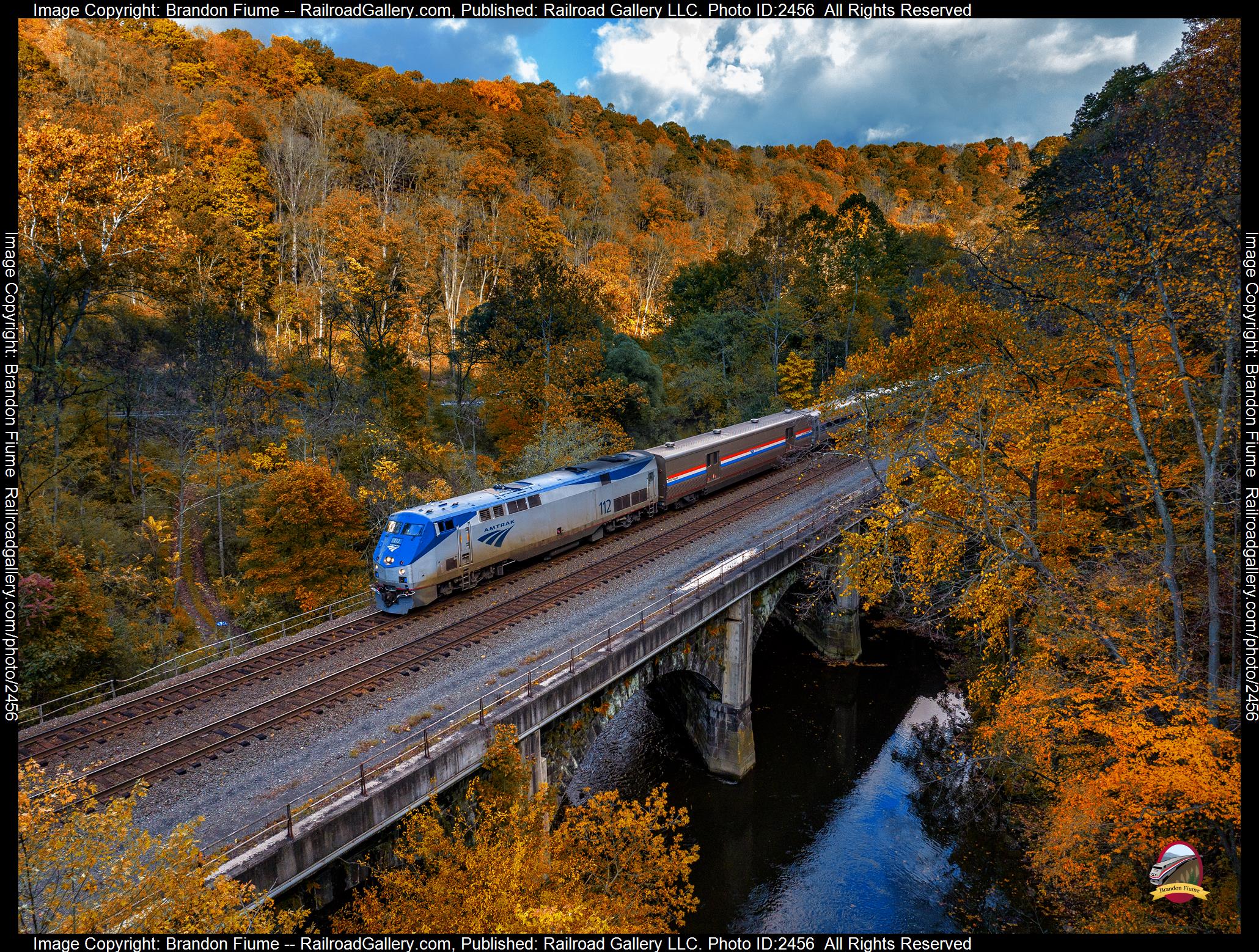 AMTK 112 is a class GE P42DC and  is pictured in Tyrone , Pennsylvania , USA.  This was taken along the Pittsburgh Line on the Amtrak. Photo Copyright: Brandon Fiume uploaded to Railroad Gallery on 11/16/2023. This photograph of AMTK 112 was taken on Sunday, October 15, 2023. All Rights Reserved. 