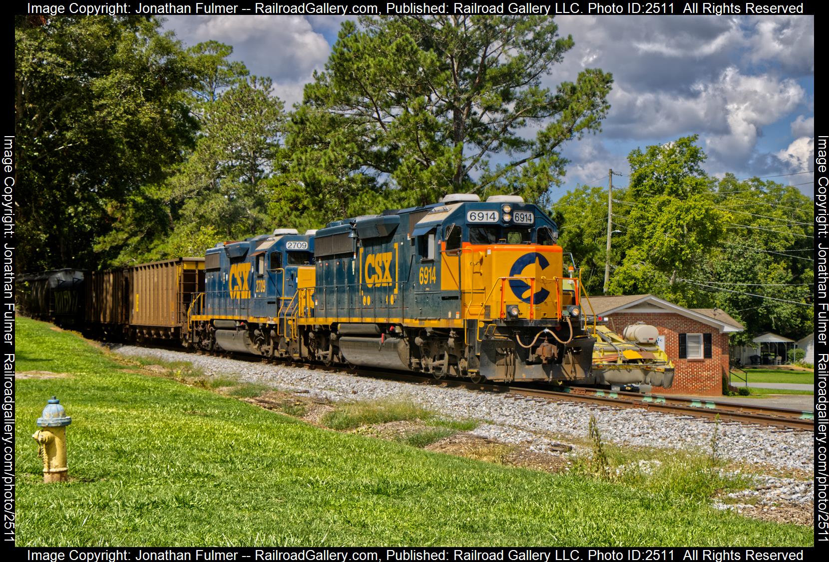 CSX 6914 is a class EMD GP40-2 and  is pictured in Taylorsville, Georgia, United States.  This was taken along the CSX Cartersville Sub on the CSX Transportation. Photo Copyright: Jonathan Fulmer uploaded to Railroad Gallery on 11/28/2023. This photograph of CSX 6914 was taken on Thursday, August 17, 2023. All Rights Reserved. 