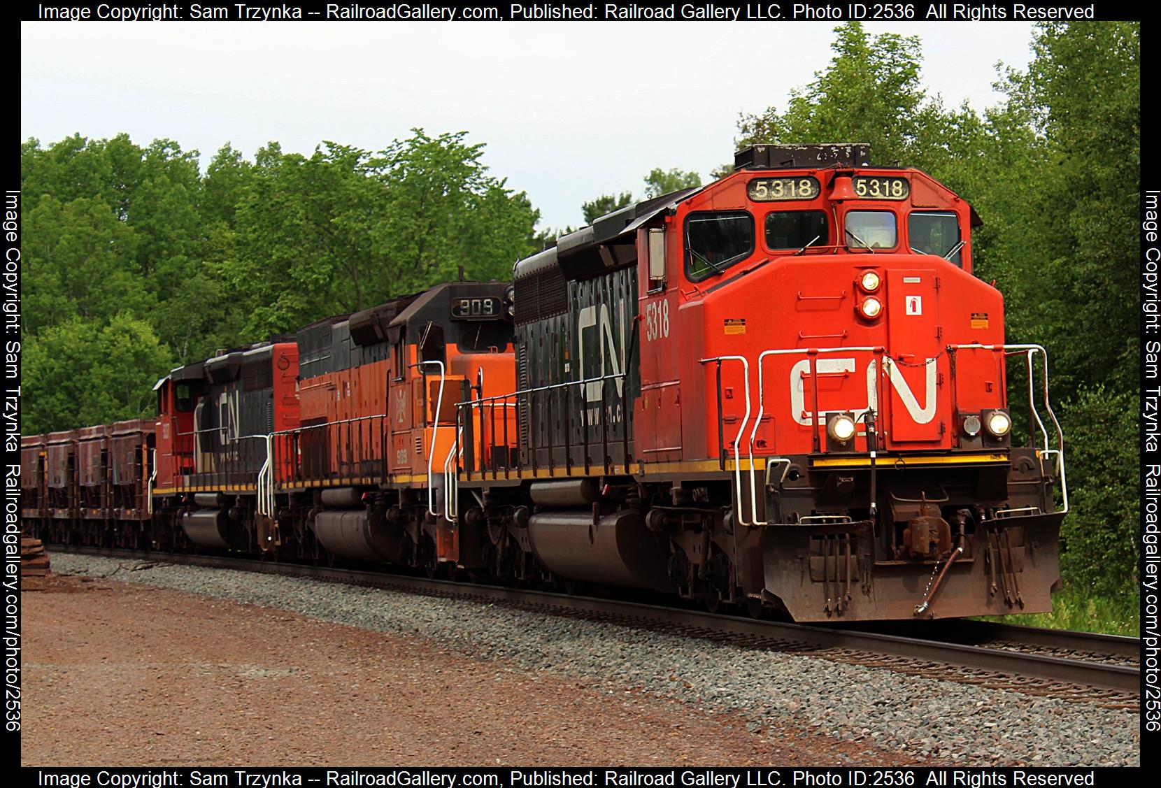 CN 5318 is a class EMD SD40-2W and  is pictured in Munger, Minnesota, USA.  This was taken along the CN Missabe Subdivision on the Canadian National Railway. Photo Copyright: Sam Trzynka uploaded to Railroad Gallery on 11/30/2023. This photograph of CN 5318 was taken on Saturday, July 16, 2022. All Rights Reserved. 