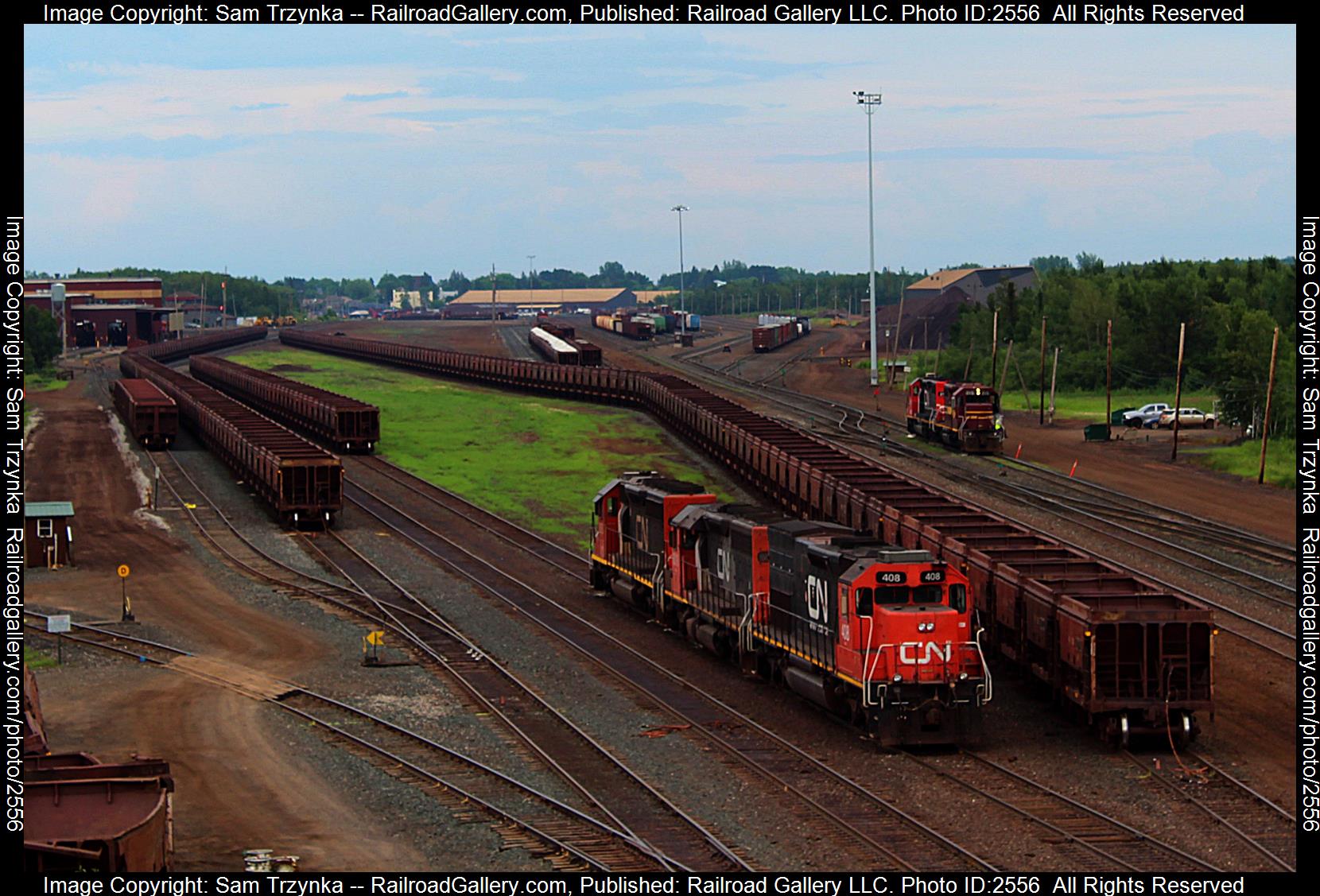 DMIR 408 is a class EMD SD40-3 and  is pictured in Proctor, Minnesota, USA.  This was taken along the CN Missabe Subdivision on the Canadian National Railway. Photo Copyright: Sam Trzynka uploaded to Railroad Gallery on 12/02/2023. This photograph of DMIR 408 was taken on Saturday, July 16, 2022. All Rights Reserved. 