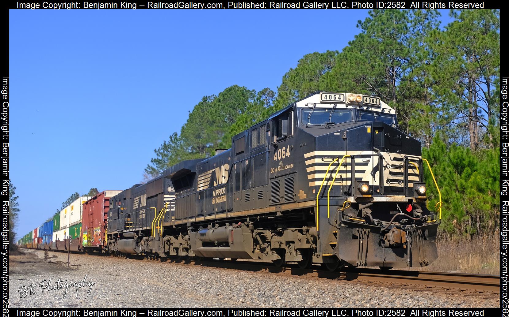 NS 4064 is a class GE AC44C6M and  is pictured in Crawford, Florida, USA.  This was taken along the NS GS&F Subdivision on the Norfolk Southern. Photo Copyright: Benjamin King uploaded to Railroad Gallery on 12/05/2023. This photograph of NS 4064 was taken on Saturday, February 26, 2022. All Rights Reserved. 