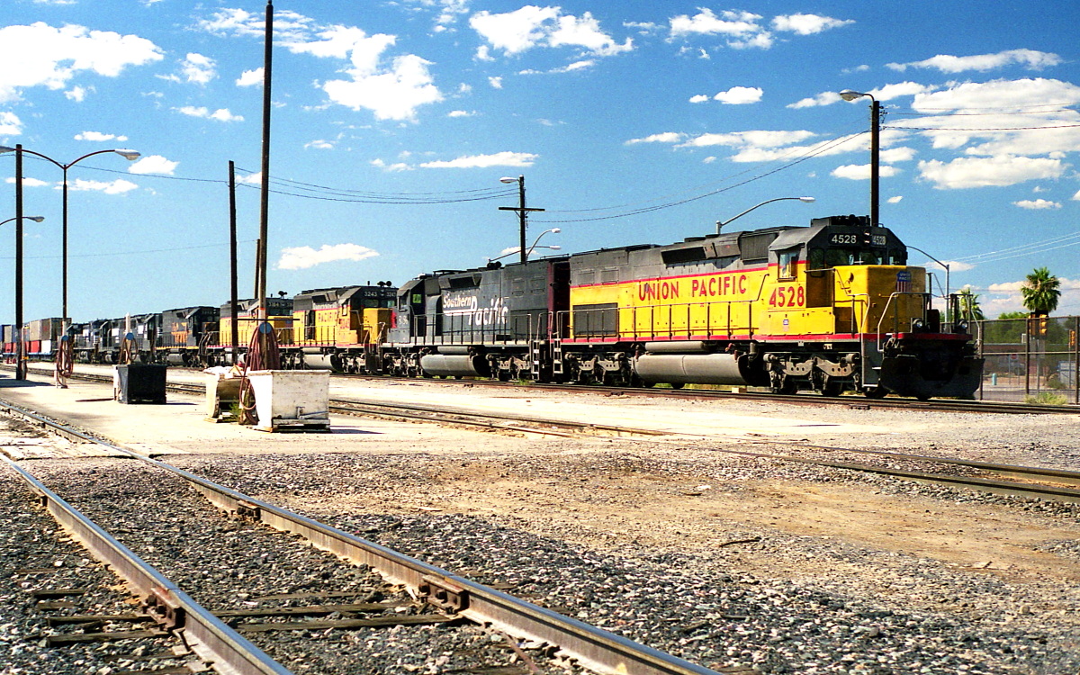 UP 4528 is a class SD40T-2 and  is pictured in Tucson, Arizona, USA.  This was taken along the Tucson Lordsburg District/SP on the Union Pacific Railroad. Photo Copyright: Rick Doughty uploaded to Railroad Gallery on 12/05/2023. This photograph of UP 4528 was taken on Saturday, October 02, 1999. All Rights Reserved. 