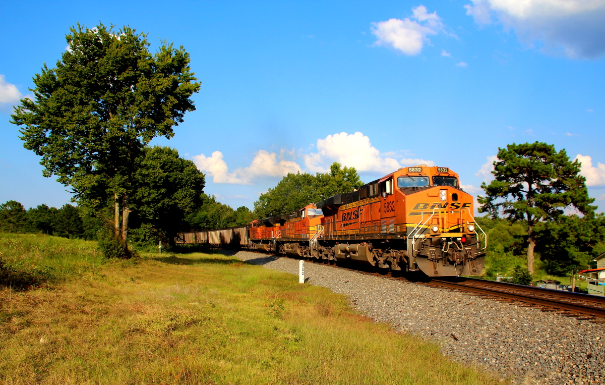 BNSF 5832 is a class GE ES44AC and  is pictured in Heavener, Oklahoma, USA.  This was taken along the Shreveport/KCS on the BNSF Railway. Photo Copyright: Rick Doughty uploaded to Railroad Gallery on 12/09/2023. This photograph of BNSF 5832 was taken on Saturday, August 22, 2020. All Rights Reserved. 