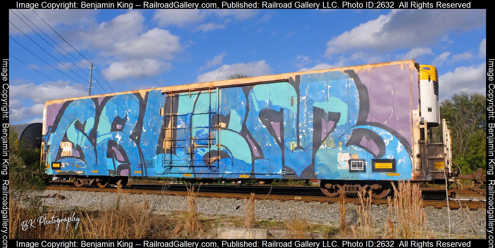 CRYX 3058 is a class 64ft 6495cf Refrigerated High Cube Box Car and  is pictured in Waycross, Georgia, USA.  This was taken along the CSXT Fitzgerald Subdivision on the CSX Transportation. Photo Copyright: Benjamin King uploaded to Railroad Gallery on 12/11/2023. This photograph of CRYX 3058 was taken on Saturday, January 01, 2022. All Rights Reserved. 