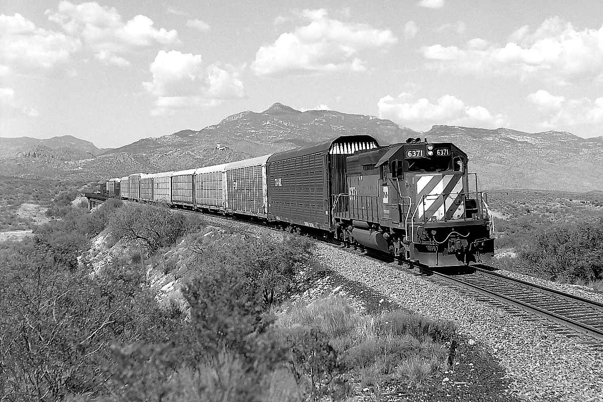 BN 6371 is a class EMD SD40 and  is pictured in Pantano, Arizona, USA.  This was taken along the Lordsburg/SP on the Burlington Northern Railroad. Photo Copyright: Rick Doughty uploaded to Railroad Gallery on 12/13/2023. This photograph of BN 6371 was taken on Tuesday, June 02, 1992. All Rights Reserved. 