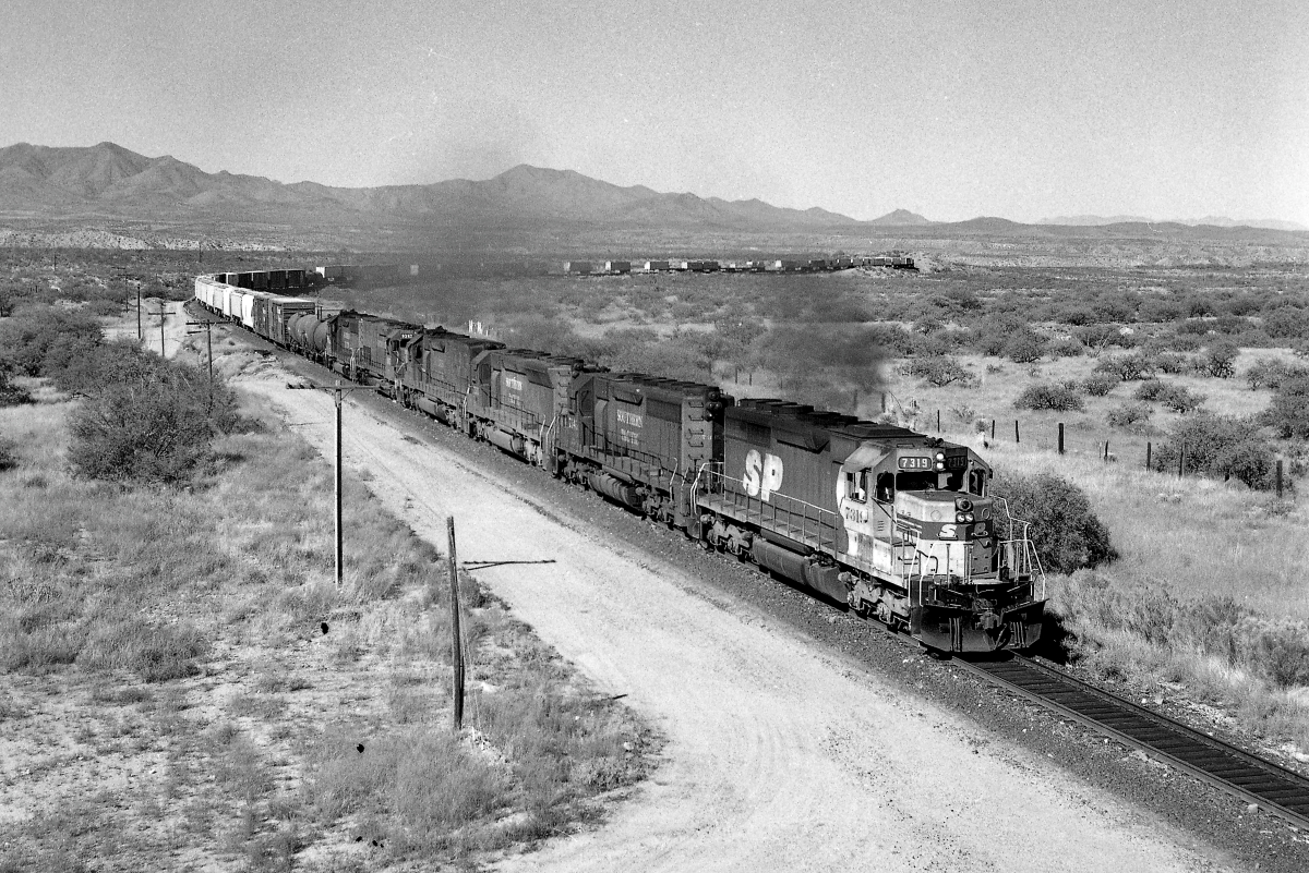 SP 7319 is a class EMD SD40 and  is pictured in Mescal, Arizona, USA.  This was taken along the Lordsburg/SP on the Southern Pacific Transportation Company. Photo Copyright: Rick Doughty uploaded to Railroad Gallery on 12/13/2023. This photograph of SP 7319 was taken on Thursday, October 15, 1987. All Rights Reserved. 