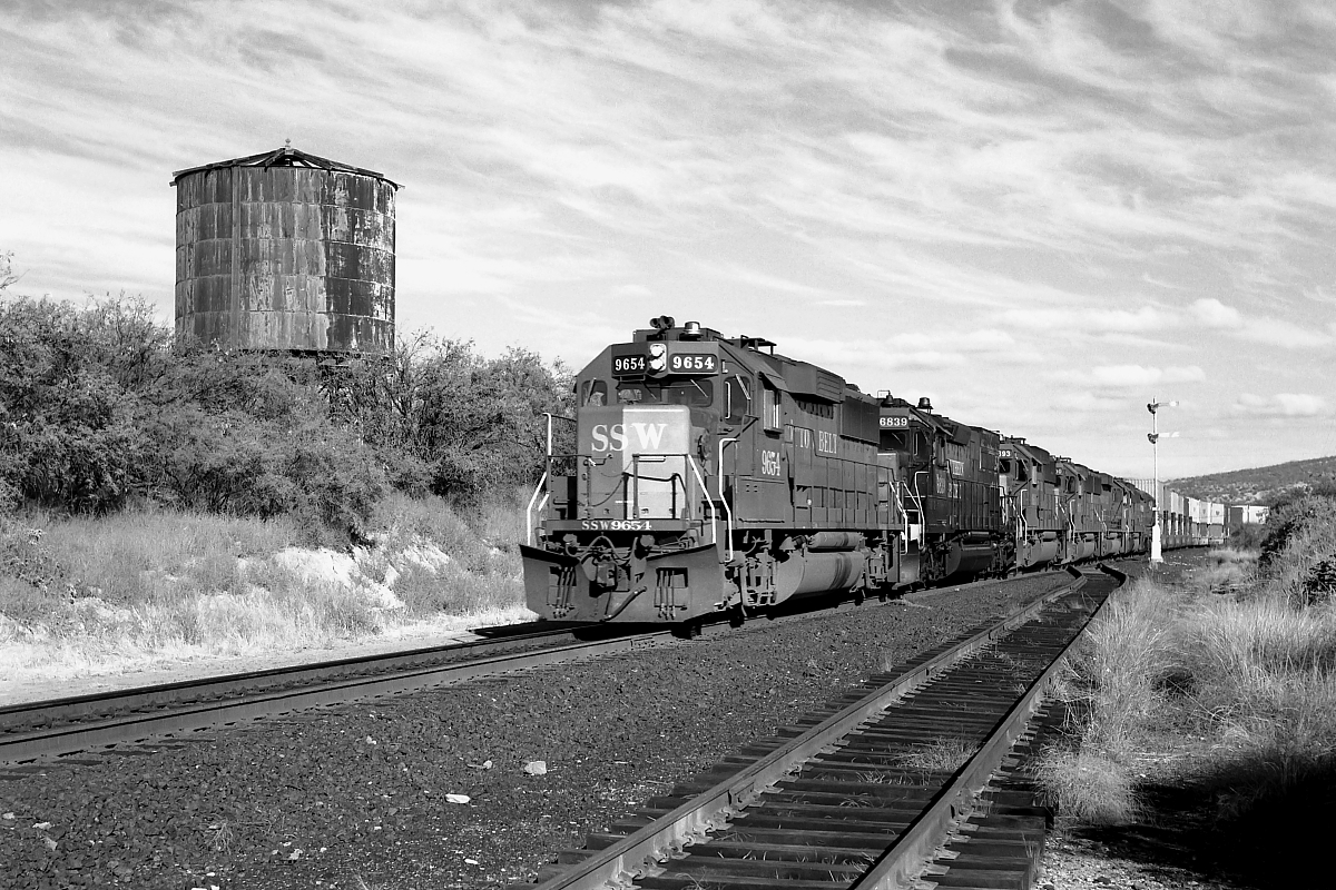 SSW 9654 is a class EMD GP60 and  is pictured in Pantano, Arizona, USA.  This was taken along the Lordsburg/SP on the St Louis & Southwestern . Photo Copyright: Rick Doughty uploaded to Railroad Gallery on 12/13/2023. This photograph of SSW 9654 was taken on Sunday, September 09, 1990. All Rights Reserved. 