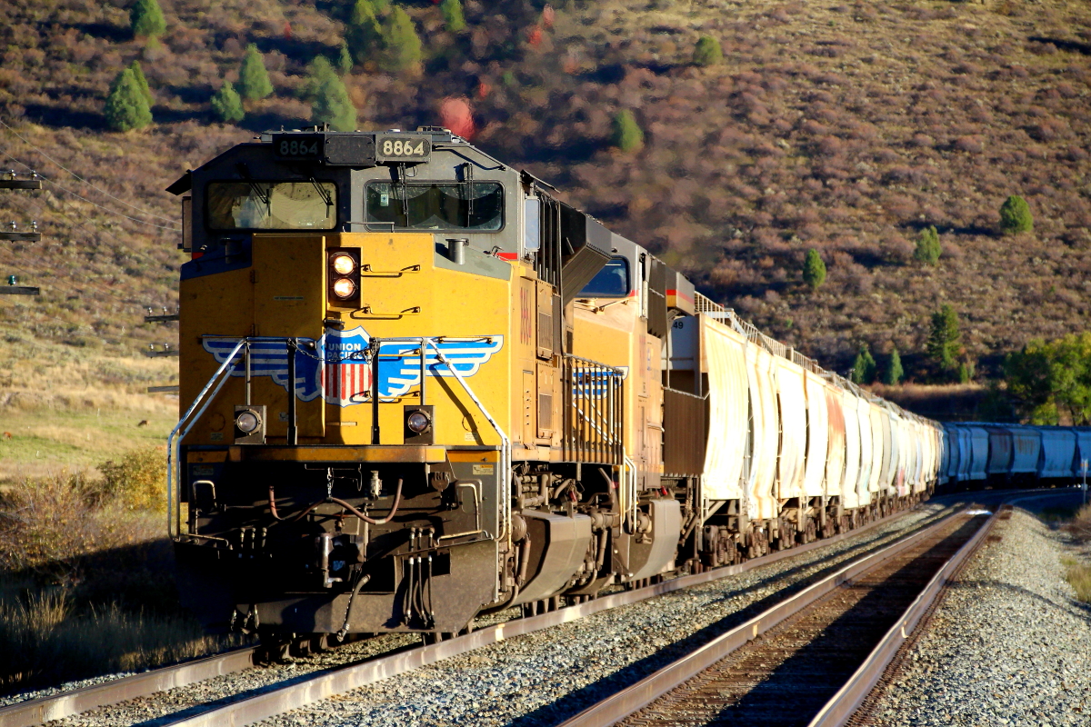 UP 8864 is a class EMD SD70ACe and  is pictured in Lava Hot Springs, Idaho, USA.  This was taken along the Pocatello/UP on the Union Pacific Railroad. Photo Copyright: Rick Doughty uploaded to Railroad Gallery on 12/17/2023. This photograph of UP 8864 was taken on Friday, October 14, 2022. All Rights Reserved. 