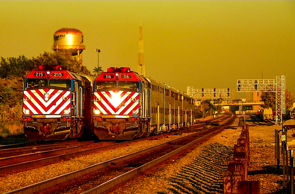 METX 215 is a class EMD F40PH-3 and  is pictured in Chicago, Illinois, USA.  This was taken along the Elgin on the Metra. Photo Copyright: Lawrence Amaloo uploaded to Railroad Gallery on 11/28/2022. This photograph of METX 215 was taken on Wednesday, October 05, 2011. All Rights Reserved. 