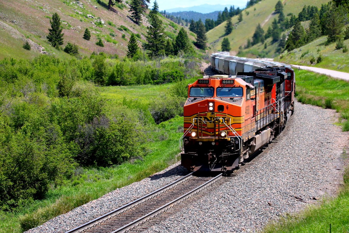 BNSF 4688 is a class GE ES44AC and  is pictured in Austin, Montana, USA.  This was taken along the 3rd Sub/MRL on the BNSF Railway. Photo Copyright: Rick Doughty uploaded to Railroad Gallery on 12/20/2023. This photograph of BNSF 4688 was taken on Friday, June 23, 2023. All Rights Reserved. 