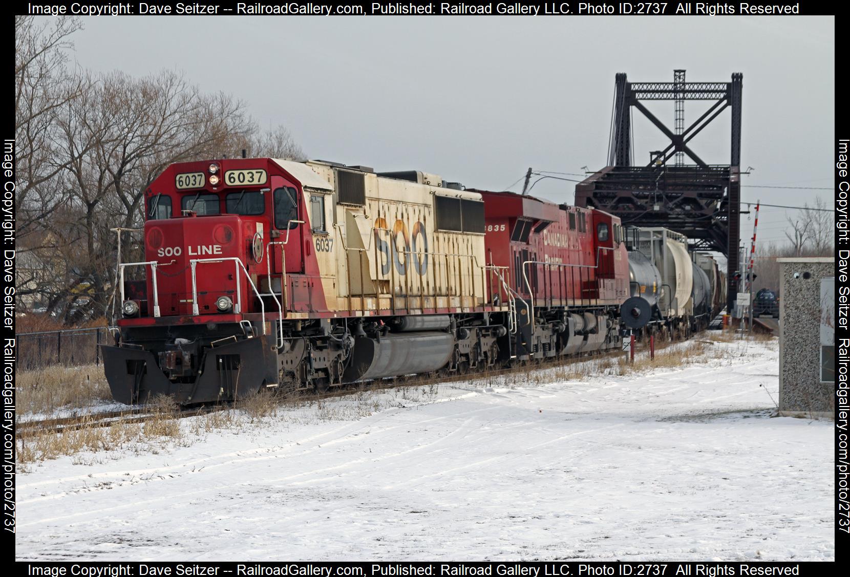 SOO 6037  CP 8835 is a class SD60  ES44AC and  is pictured in Black Rock, New York, United States.  This was taken along the Stanford on the Canadian National Railway. Photo Copyright: Dave Seitzer uploaded to Railroad Gallery on 12/20/2023. This photograph of SOO 6037  CP 8835 was taken on Monday, January 25, 2016. All Rights Reserved. 