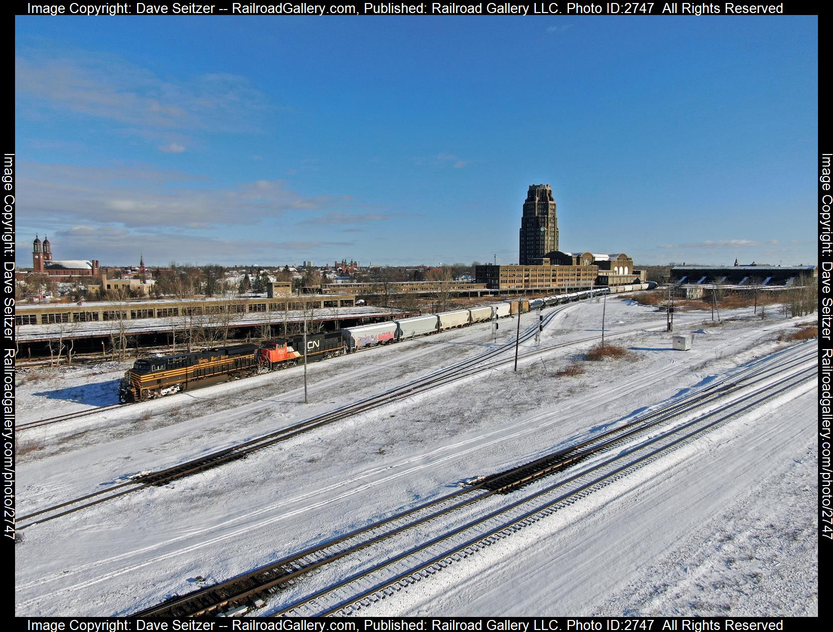 NS 8100 CN 5702 is a class ES44AC SD75I and  is pictured in Buffalo, New York, United States.  This was taken along the Belt on the CSX. Photo Copyright: Dave Seitzer uploaded to Railroad Gallery on 12/21/2023. This photograph of NS 8100 CN 5702 was taken on Thursday, March 03, 2022. All Rights Reserved. 