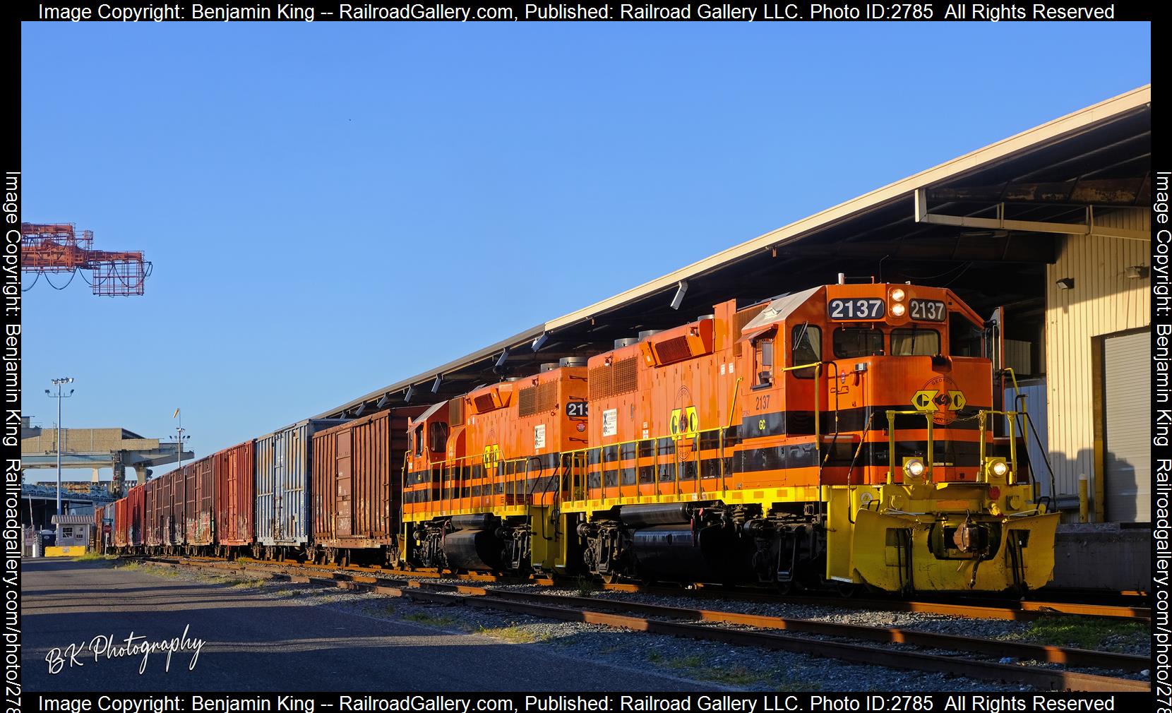 GC 2137 is a class EMD GP38-2 and  is pictured in Fernandina Beach, Florida, USA.  This was taken along the FCRD on the First Coast Railroad. Photo Copyright: Benjamin King uploaded to Railroad Gallery on 12/26/2023. This photograph of GC 2137 was taken on Monday, August 08, 2022. All Rights Reserved. 