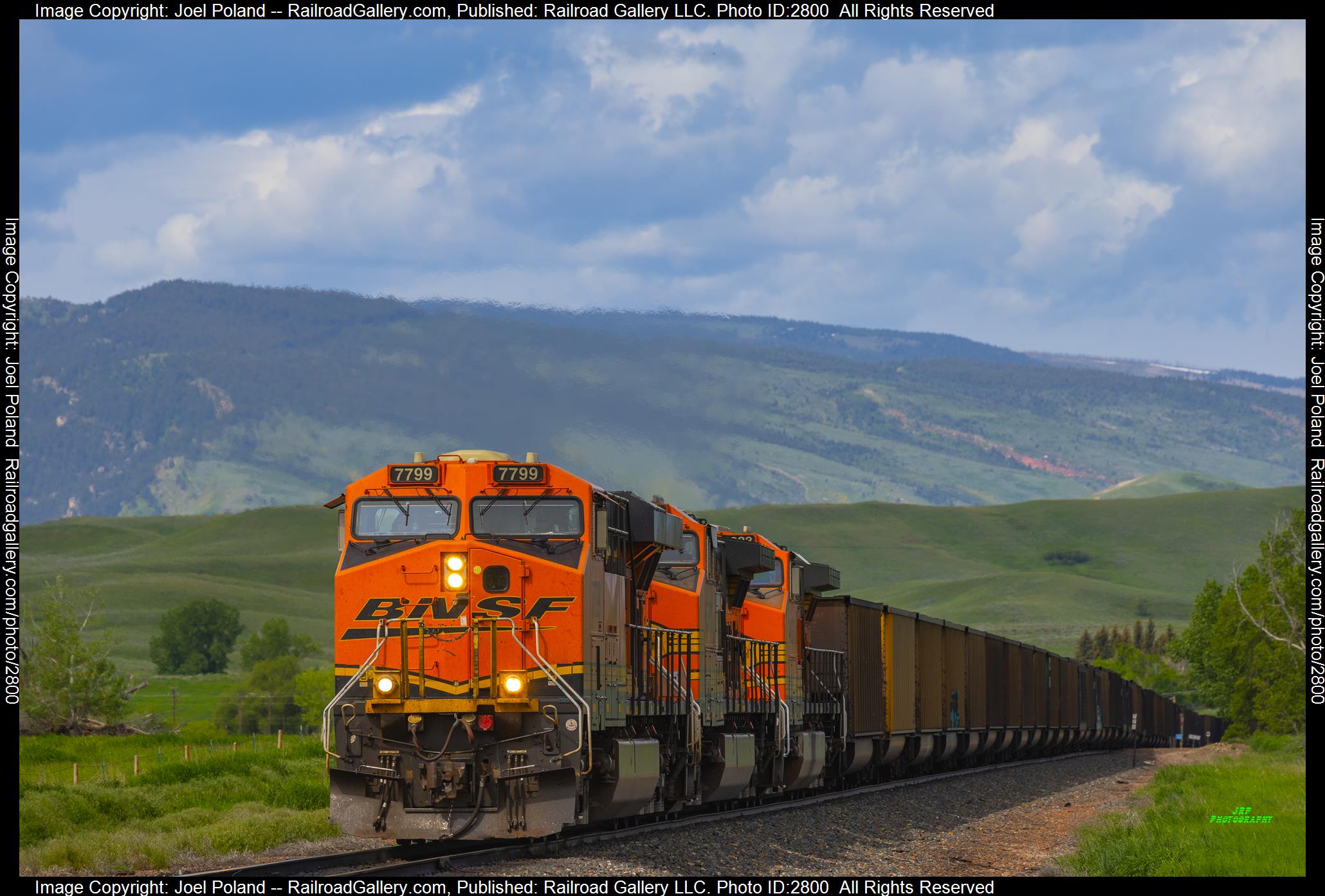 BNSF 7799 is a class GE ES44DC and  is pictured in Ranchester, Wyoming, USA.  This was taken along the Big Horn Sub on the BNSF Railway. Photo Copyright: Joel Poland uploaded to Railroad Gallery on 12/27/2023. This photograph of BNSF 7799 was taken on Thursday, June 01, 2023. All Rights Reserved. 