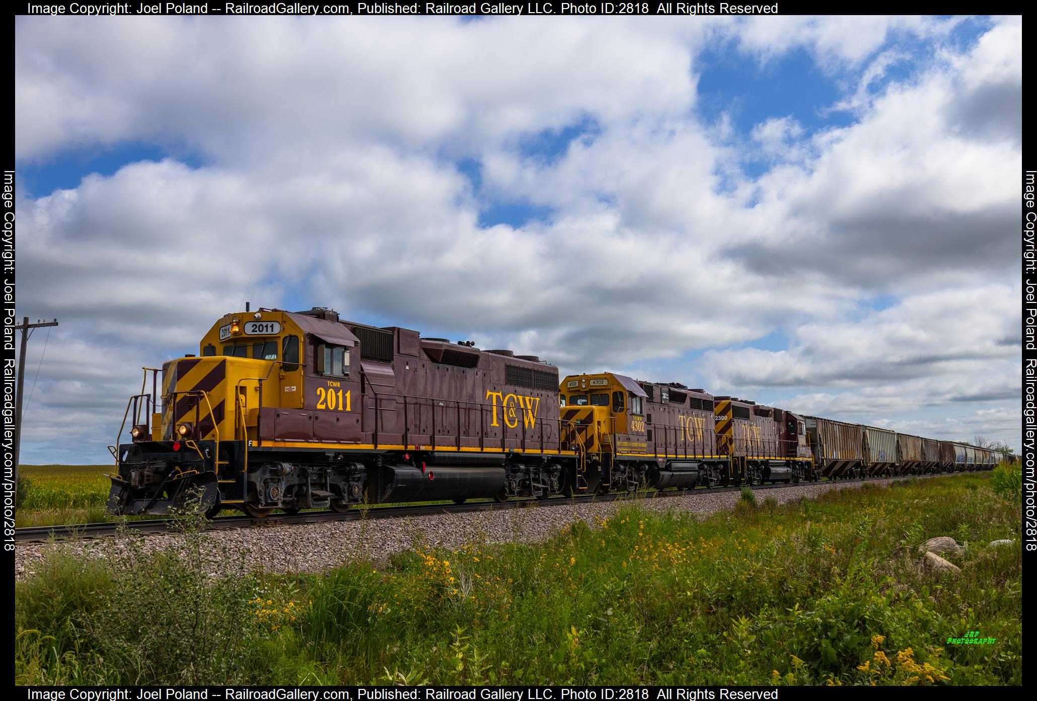 TCW 2011 is a class GP38-2 and  is pictured in Ruebel, Minnesota, USA.  This was taken along the Ortonville Line on the Twin Cities and Western Railroad. Photo Copyright: Joel Poland uploaded to Railroad Gallery on 12/29/2023. This photograph of TCW 2011 was taken on Saturday, August 26, 2023. All Rights Reserved. 