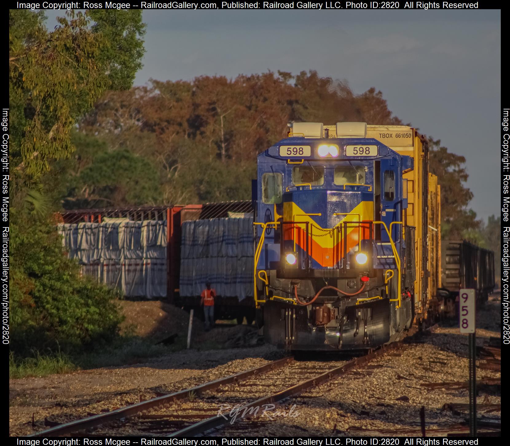 SGLR 598 is a class GE B40-8 (Dash 8-40B) and  is pictured in Fort Myers, Florida, USA.  This was taken along the Fort Myers Subdivision on the Seminole Gulf Railway. Photo Copyright: Ross Mcgee uploaded to Railroad Gallery on 12/29/2023. This photograph of SGLR 598 was taken on Friday, December 29, 2023. All Rights Reserved. 