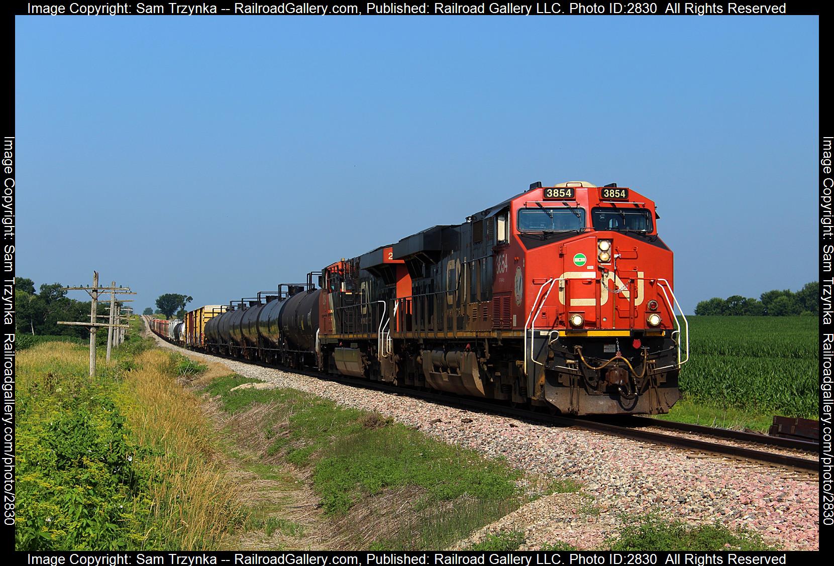 CN 3854 is a class GE ES44AC and  is pictured in Jesup, Iowa, USA.  This was taken along the CN Dubuque Subdivision on the Canadian National Railway. Photo Copyright: Sam Trzynka uploaded to Railroad Gallery on 12/30/2023. This photograph of CN 3854 was taken on Monday, July 03, 2023. All Rights Reserved. 