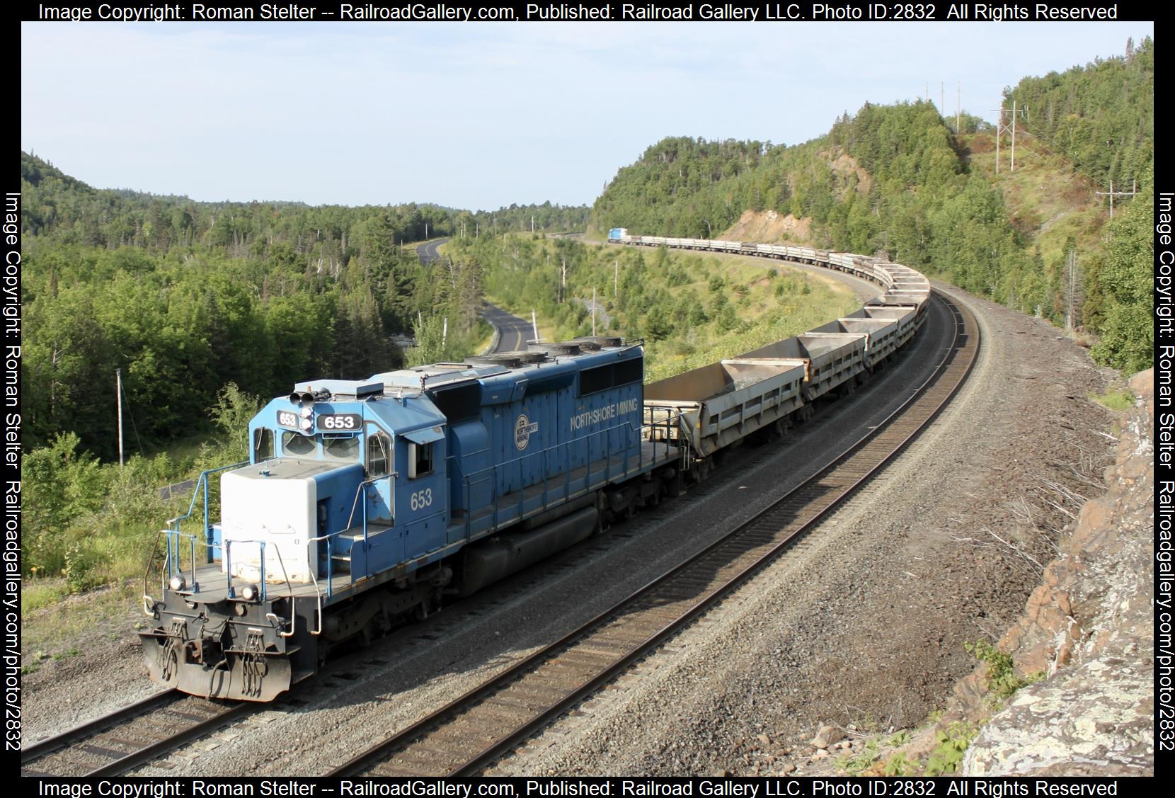 NSM 653 is a class SD40-2 and  is pictured in Silver Bay, Minnesota , United States.  This was taken along the Silver Bay - Babbit  on the Cliff's North Shore Mining. Photo Copyright: Roman Stelter uploaded to Railroad Gallery on 12/30/2023. This photograph of NSM 653 was taken on Wednesday, August 16, 2023. All Rights Reserved. 