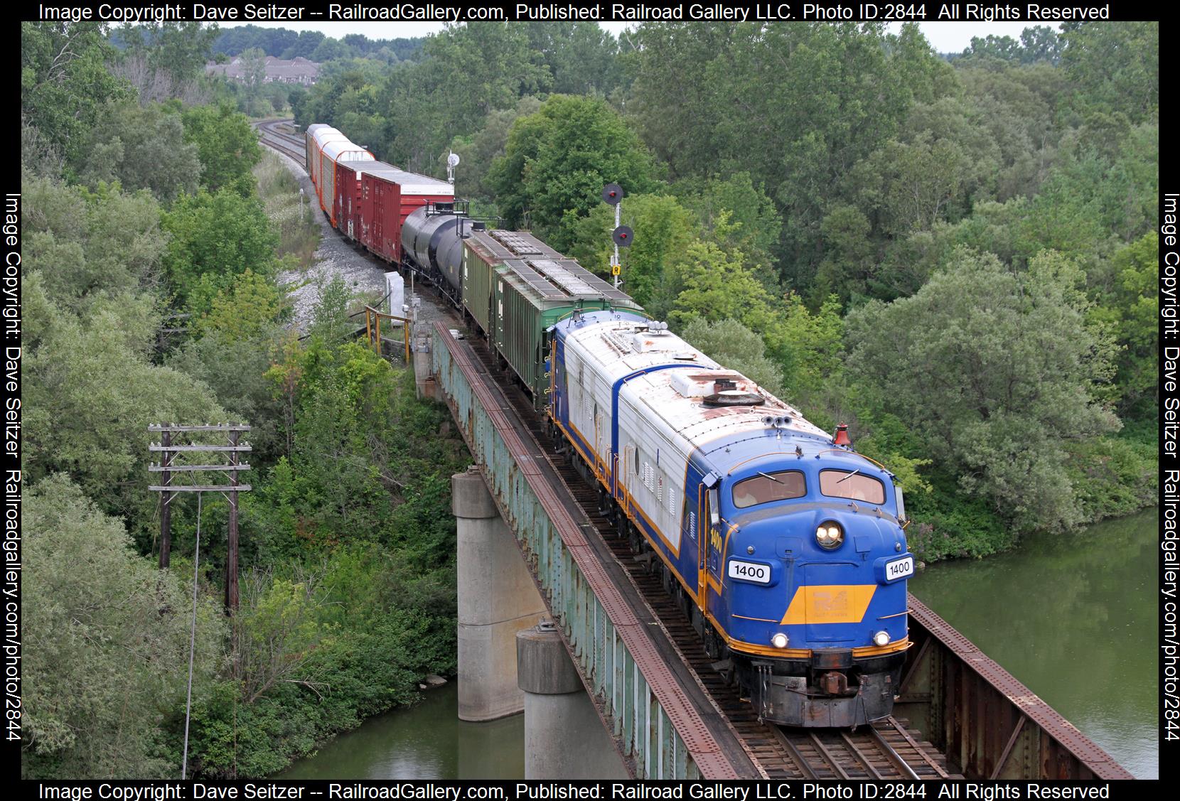 OSR 1400 OSR 1401 is a class FP9A FP9A and  is pictured in Woodstock, Ontario, Canada.  This was taken along the Woodstock on the Ontario Southland. Photo Copyright: Dave Seitzer uploaded to Railroad Gallery on 01/01/2024. This photograph of OSR 1400 OSR 1401 was taken on Tuesday, August 18, 2015. All Rights Reserved. 