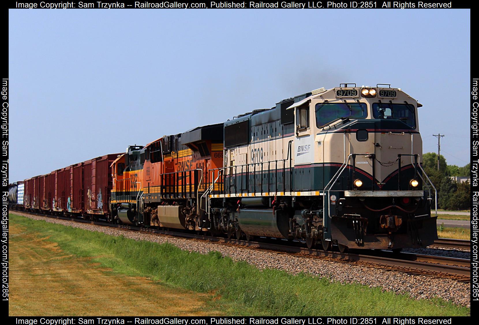 BNSF 9709 is a class EMD SD70MAC and  is pictured in Cable, Minnesota, USA.  This was taken along the BNSF Staples Subdivision on the BNSF Railway. Photo Copyright: Sam Trzynka uploaded to Railroad Gallery on 01/03/2024. This photograph of BNSF 9709 was taken on Sunday, July 09, 2023. All Rights Reserved. 