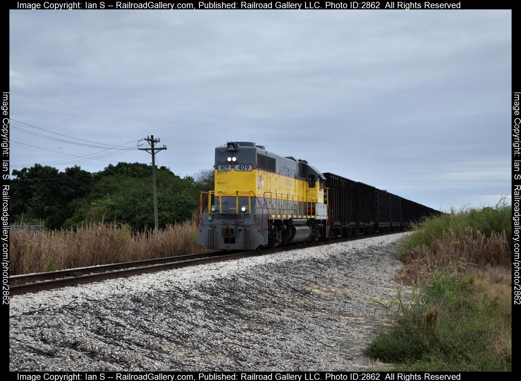 USSC 409 is a class GP38-2 and  is pictured in Clewiston, Florida, United States.  This was taken along the Clewiston Division on the US Sugar. Photo Copyright: Ian S uploaded to Railroad Gallery on 01/04/2024. This photograph of USSC 409 was taken on Saturday, November 25, 2023. All Rights Reserved. 