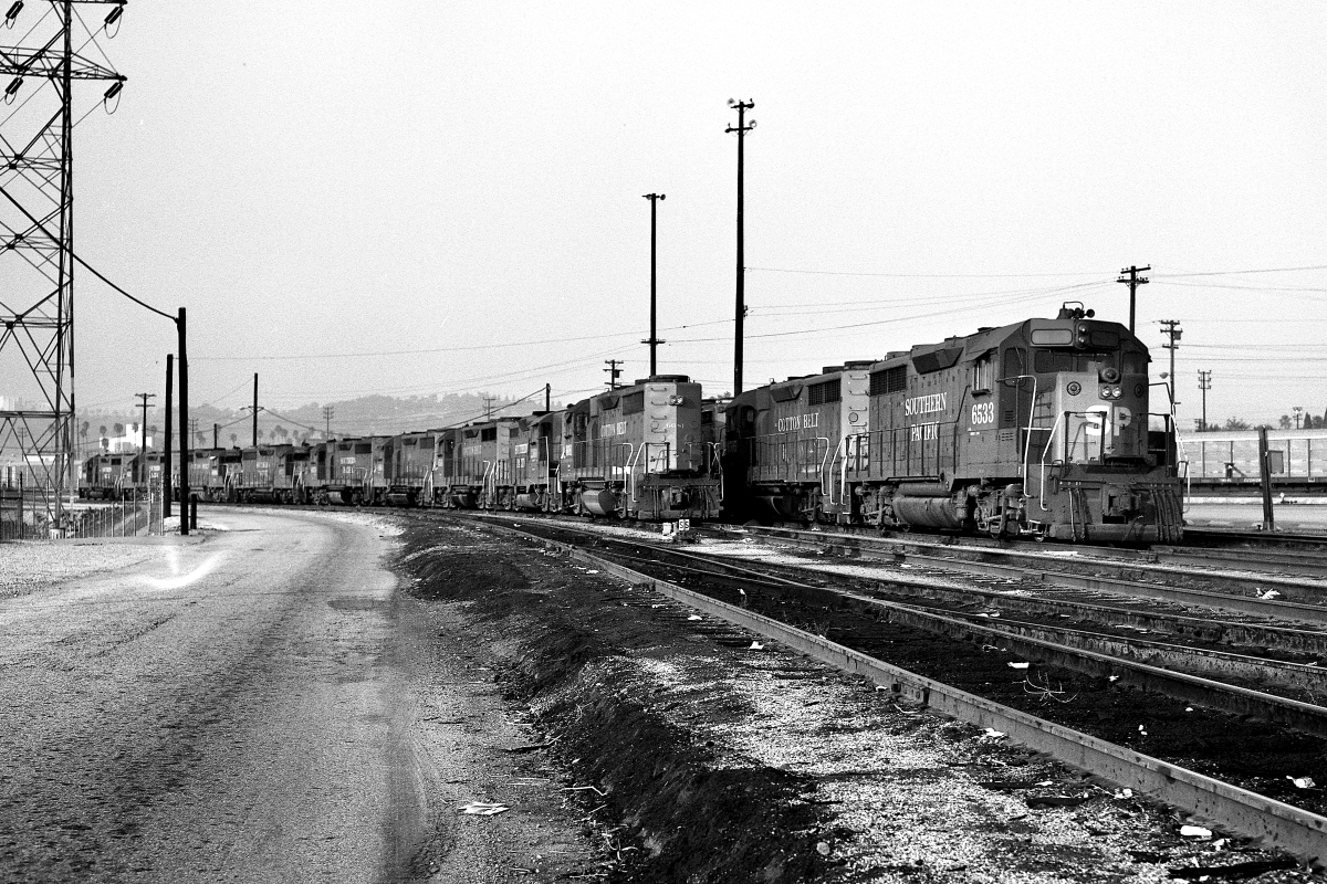 SP 6533 is a class EMD GP35 and  is pictured in Los Angeles, California, USA.  This was taken along the Los Angeles/SP on the Southern Pacific Transportation Company. Photo Copyright: Rick Doughty uploaded to Railroad Gallery on 01/05/2024. This photograph of SP 6533 was taken on Saturday, December 01, 1984. All Rights Reserved. 