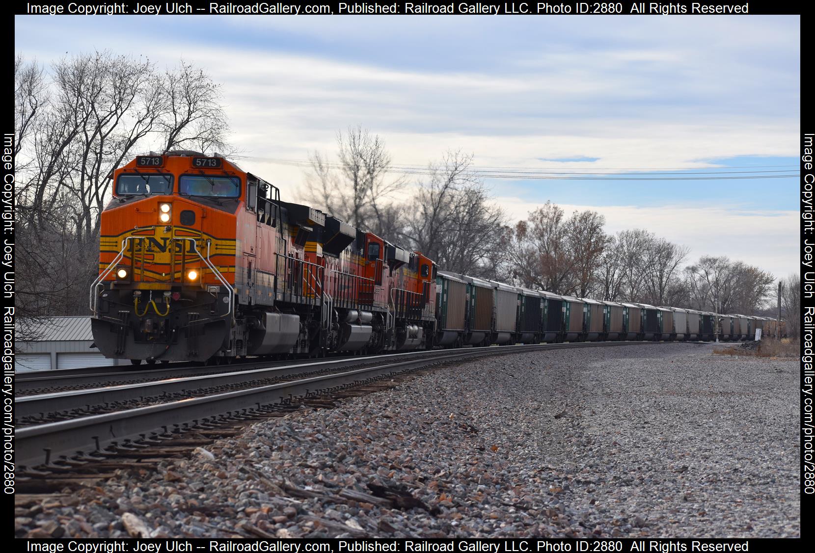 Dash 9 is a class Dash9 and  is pictured in Dallas City, IL, IA, United States.  This was taken along the 5713 on the BNSF Railway. Photo Copyright: Joey Ulch uploaded to Railroad Gallery on 01/05/2024. This photograph of Dash 9 was taken on Tuesday, December 19, 2023. All Rights Reserved. 