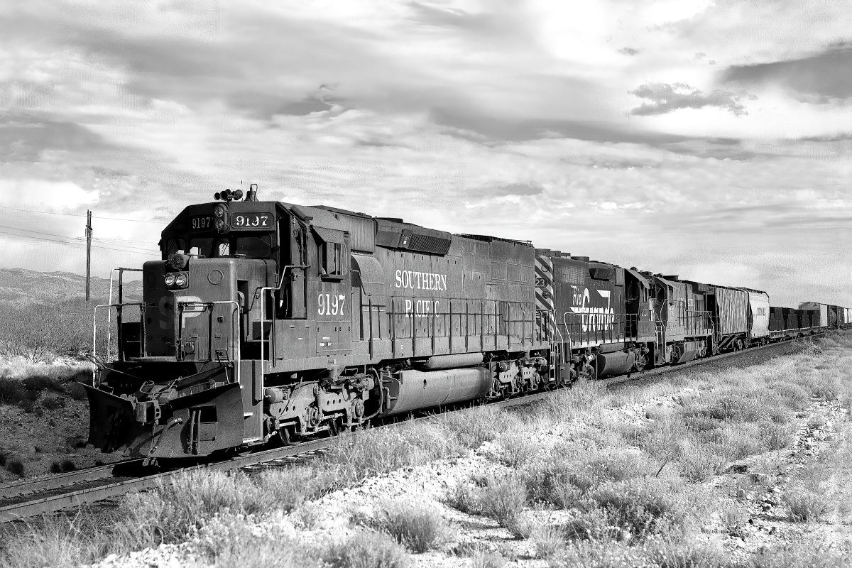 SP 9197 is a class EMD SD45T-2 and  is pictured in Vail, Arizona, USA.  This was taken along the Lordsburg/SP on the Southern Pacific Transportation Company. Photo Copyright: Rick Doughty uploaded to Railroad Gallery on 01/18/2024. This photograph of SP 9197 was taken on Wednesday, November 04, 1987. All Rights Reserved. 