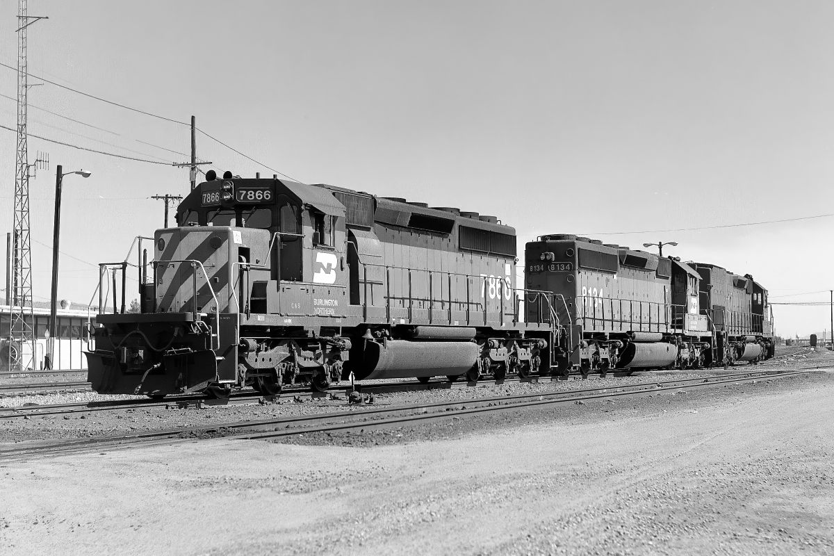 BN 7866 is a class EMD SD40-2 and  is pictured in Tucson, Arizona, USA.  This was taken along the Lordsburg/SP on the Burlington Northern Railroad. Photo Copyright: Rick Doughty uploaded to Railroad Gallery on 01/18/2024. This photograph of BN 7866 was taken on Saturday, June 08, 1991. All Rights Reserved. 