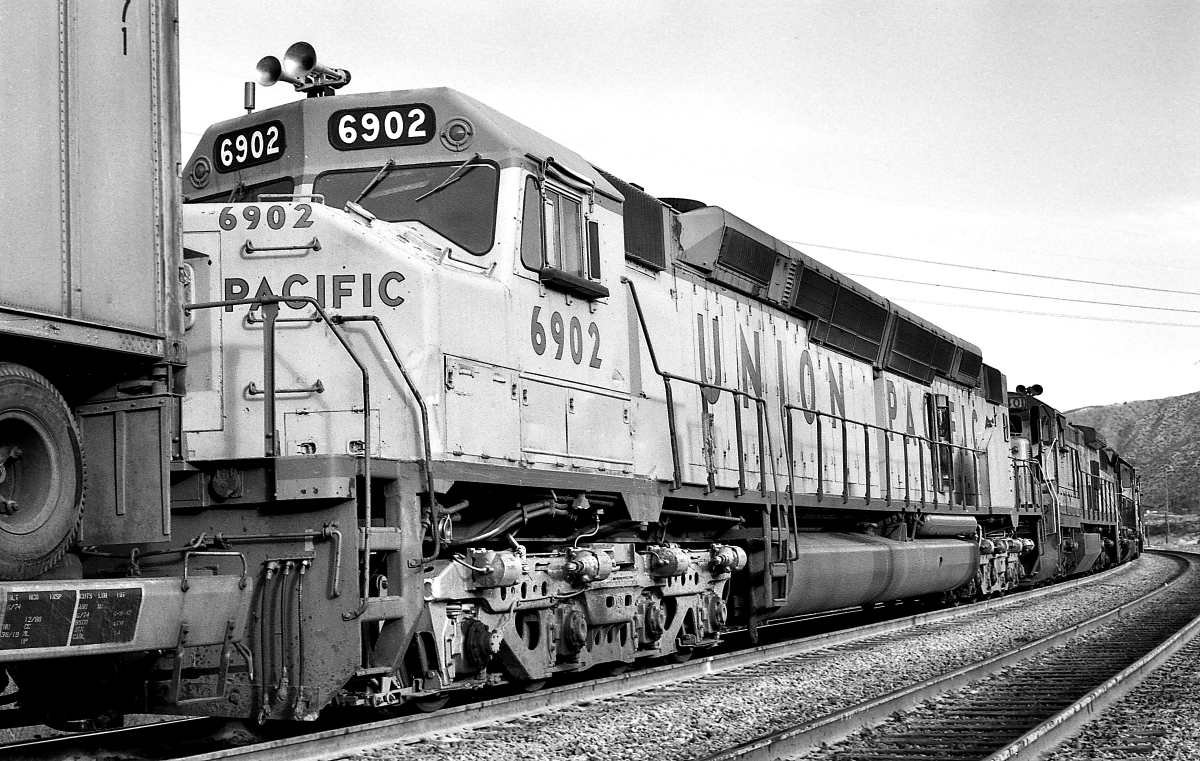 UP 6902 is a class EMD DD40X and  is pictured in Cajon, California, USA.  This was taken along the Cajon/UP on the Union Pacific Railroad. Photo Copyright: Rick Doughty uploaded to Railroad Gallery on 01/19/2024. This photograph of UP 6902 was taken on Friday, February 24, 1984. All Rights Reserved. 