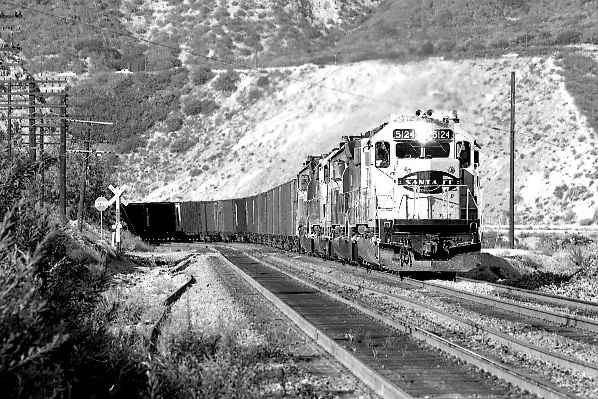 SF 5124 is a class EMD SD40-2 and  is pictured in Cajon, California, USA.  This was taken along the Cajon/SF on the Santa Fe. Photo Copyright: Rick Doughty uploaded to Railroad Gallery on 01/20/2024. This photograph of SF 5124 was taken on Saturday, November 24, 1979. All Rights Reserved. 